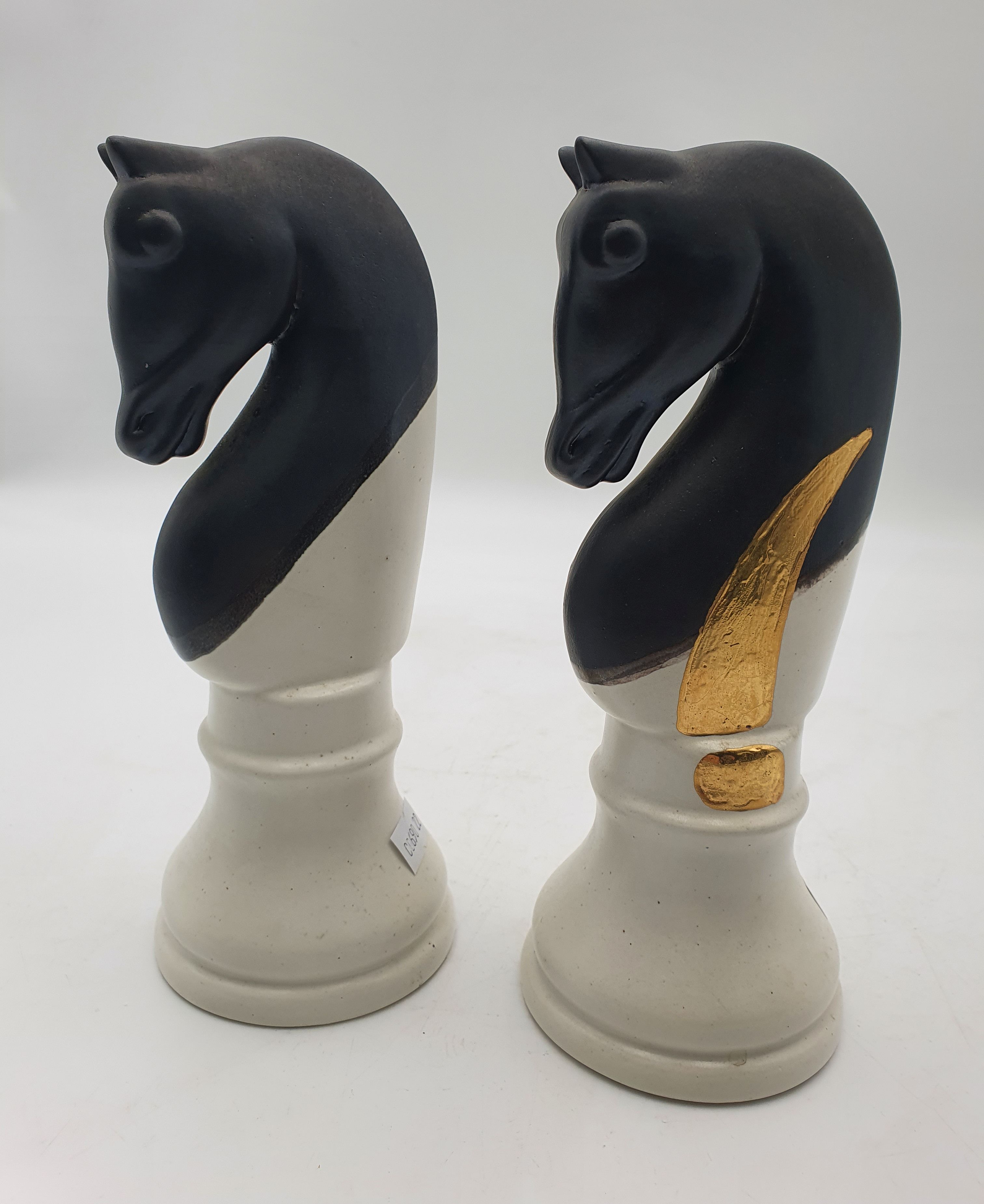 174 · A PAIR OF DECORATIVE CERAMIC KNIGHT CHESS PIECES