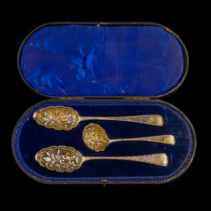 A George IV gilt sterling cased repousse spoon set