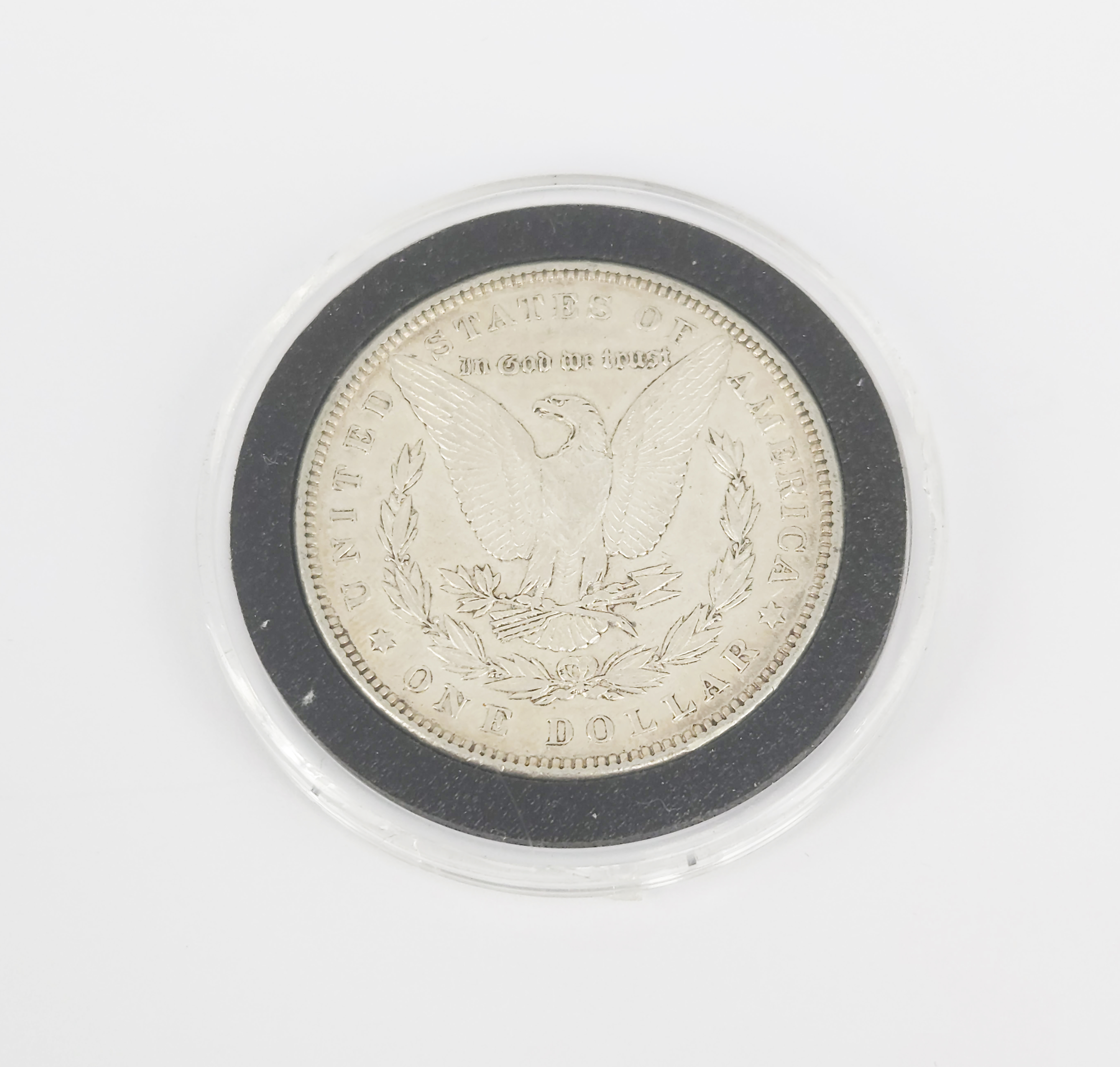 AN 1884 MORGAN SILVER UNITED STATES DOLLAR COIN