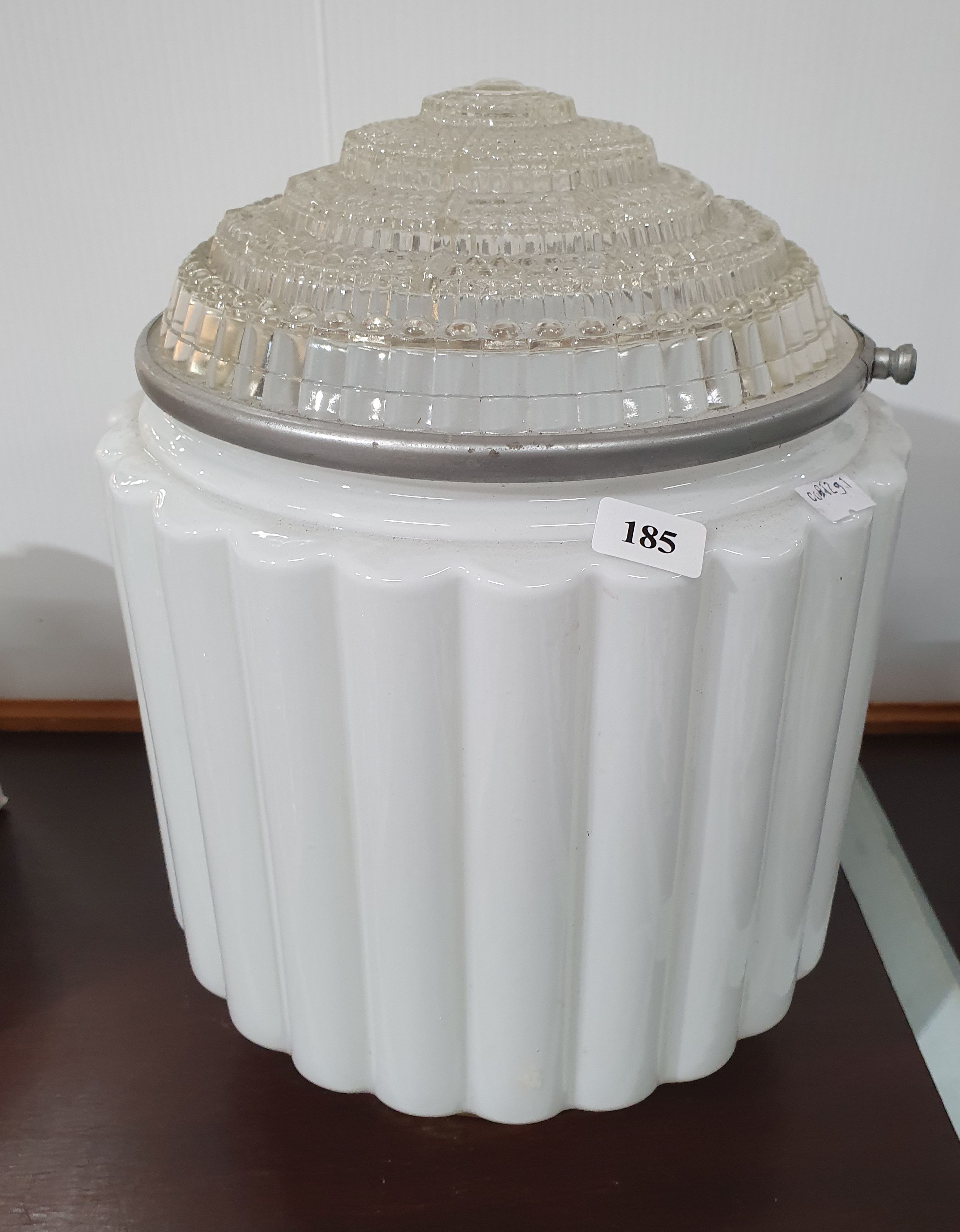 185 · A 1930s ART DECO 'SKYSCRAPER' STYLE MILK GLASS AND CLEAR GLASS CEILING LAMP
