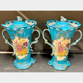 A pair of continental porcelain potpourri with covers, H. 34cm.