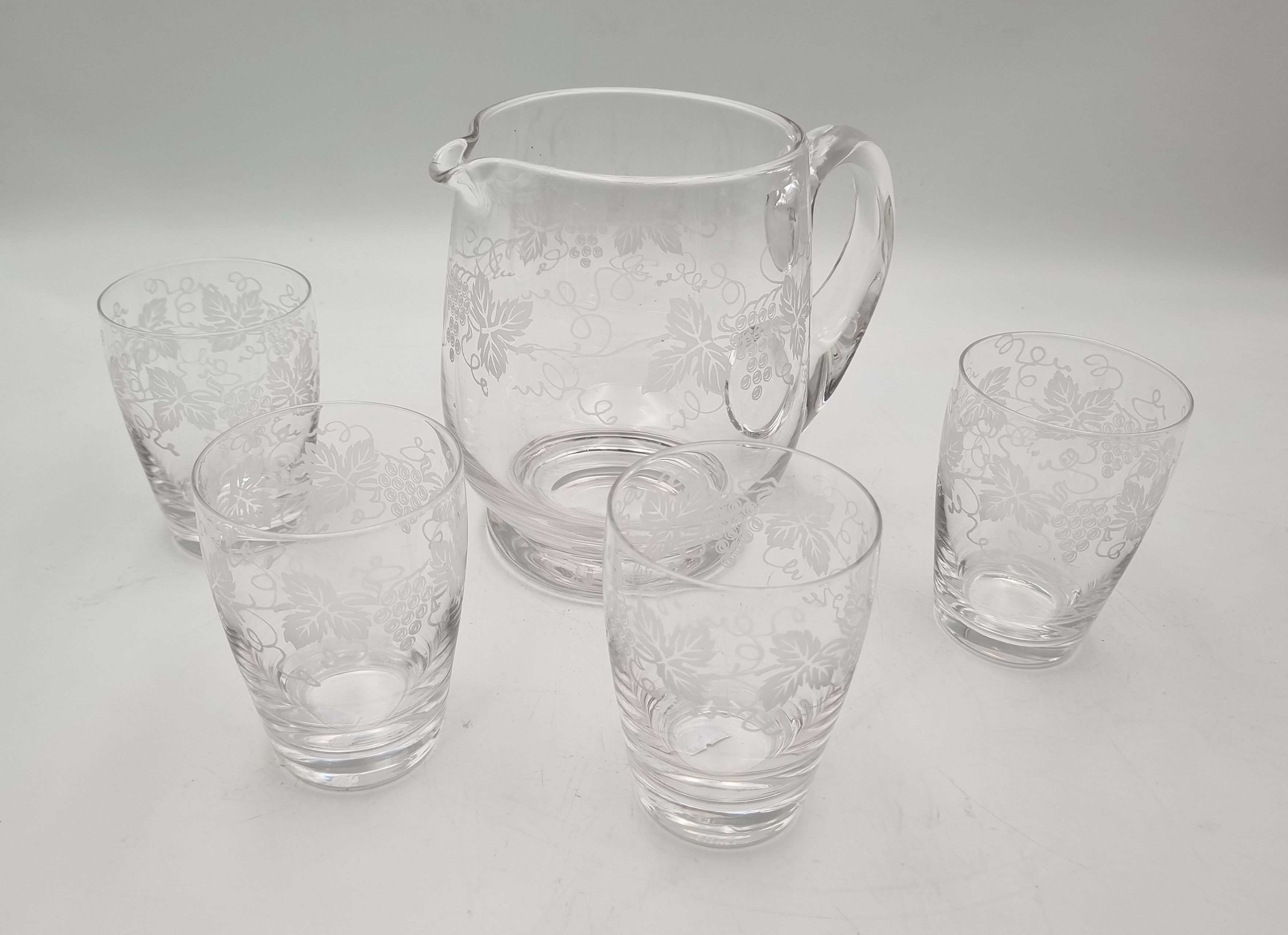 642 · A STUART CRYSTAL WATER JUG & FOUR TUMBLERS