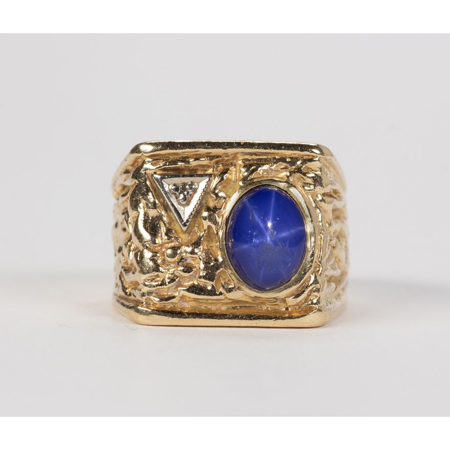 Synthetic star sapphire, diamond and 14k yellow gold ring