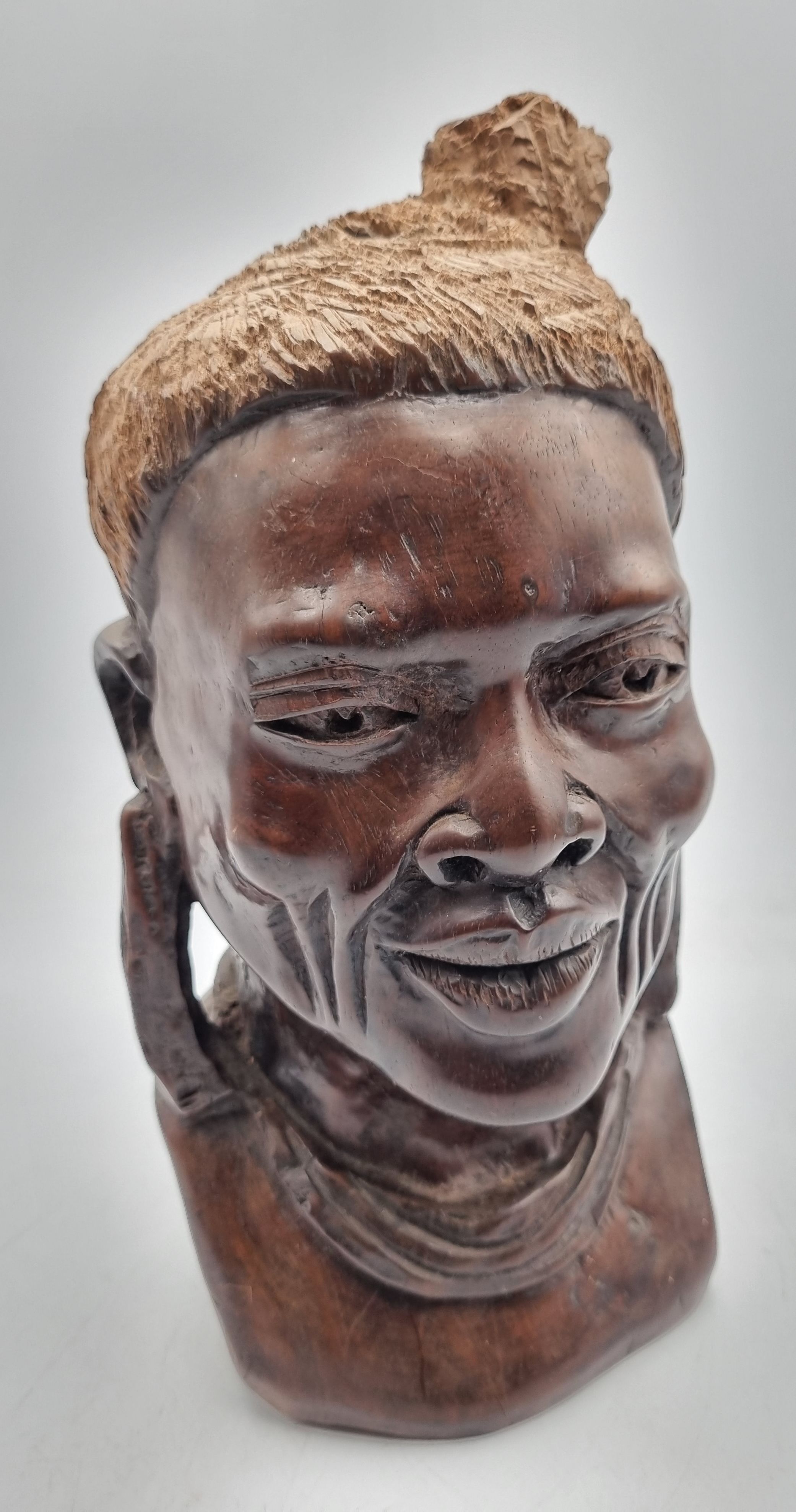 17 · A CARVED WOODEN SHONA BUST