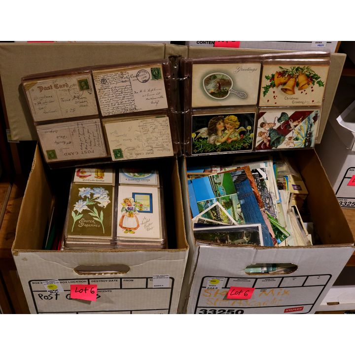 Two boxes of predominantly United States postcards