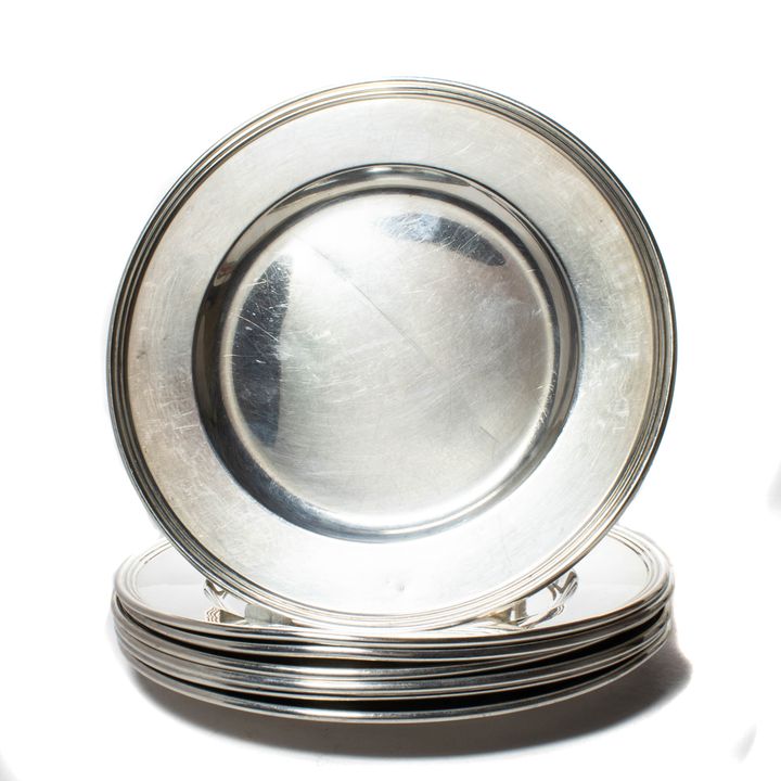 A (Set of 7) International sterling bread & butter plates