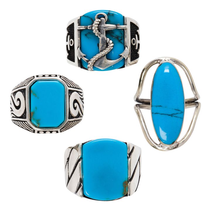 A group of four turquoise rings