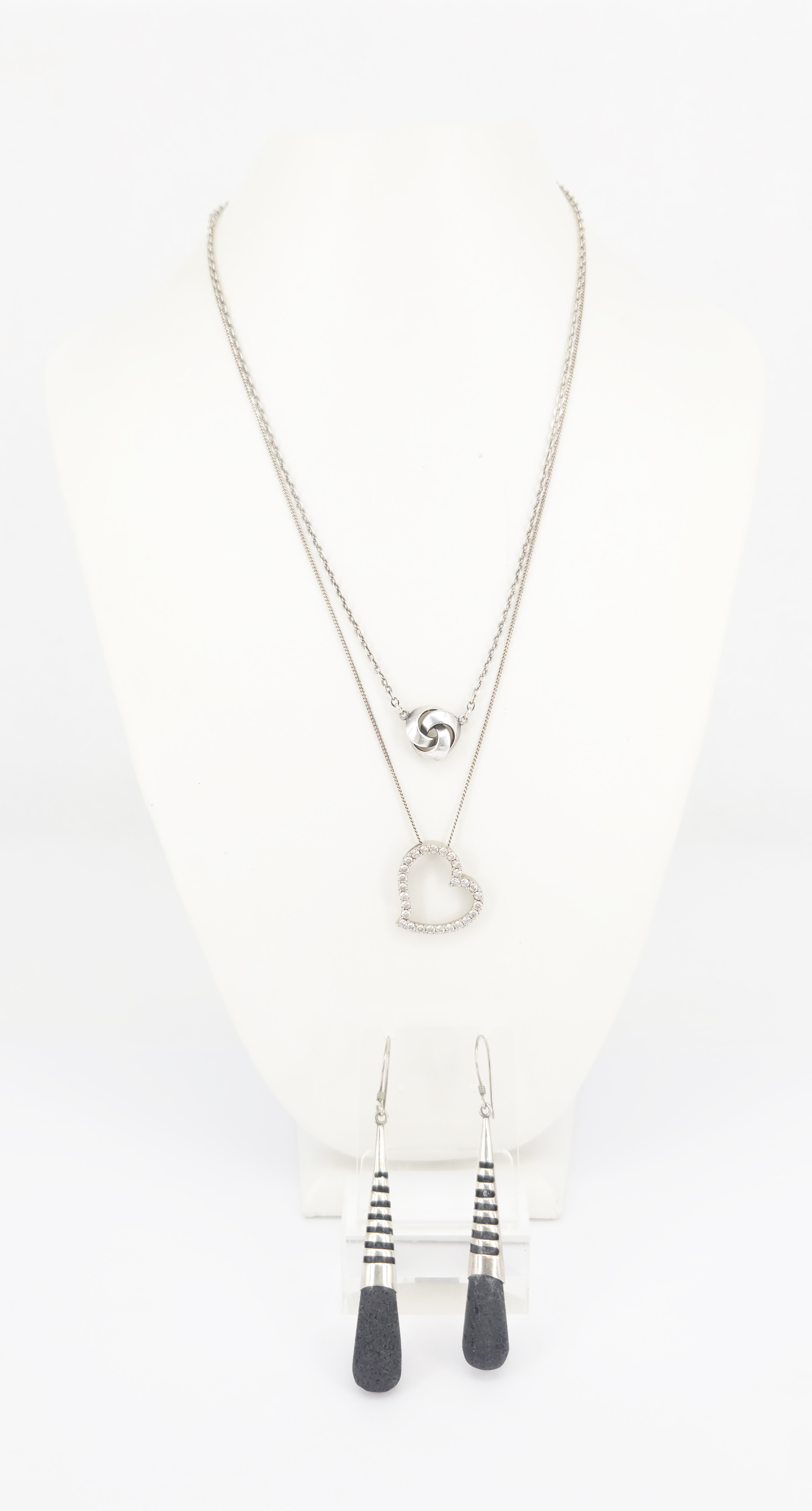 Two Silver Necklaces And A Pair Of Silver Lava Stone Drop Earrings