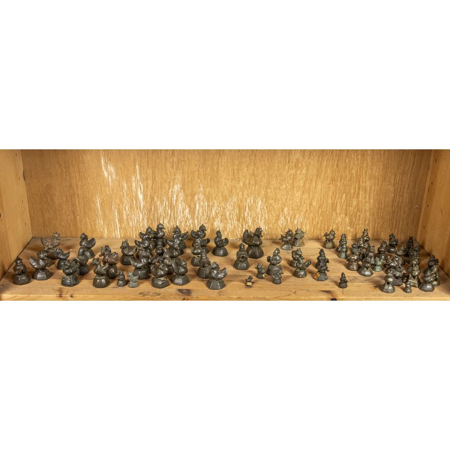 A shelf of Burmese bronze weights