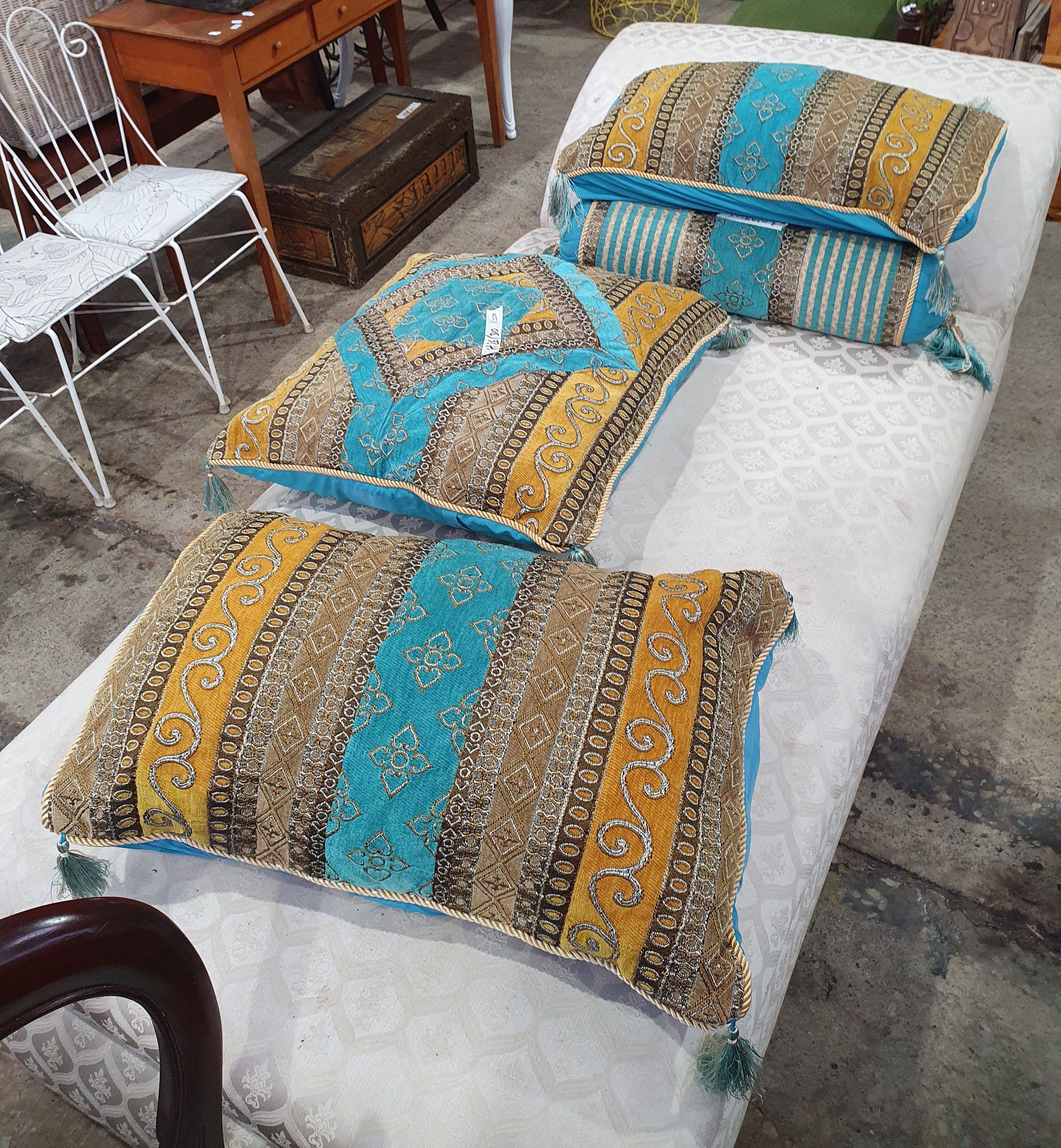 A GROUP OF PERSIAN STYLE CUSHIONS