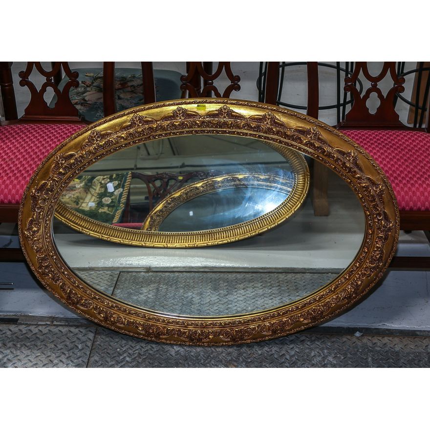 An Oval Mirror in Molded & Gilt Wood Frame