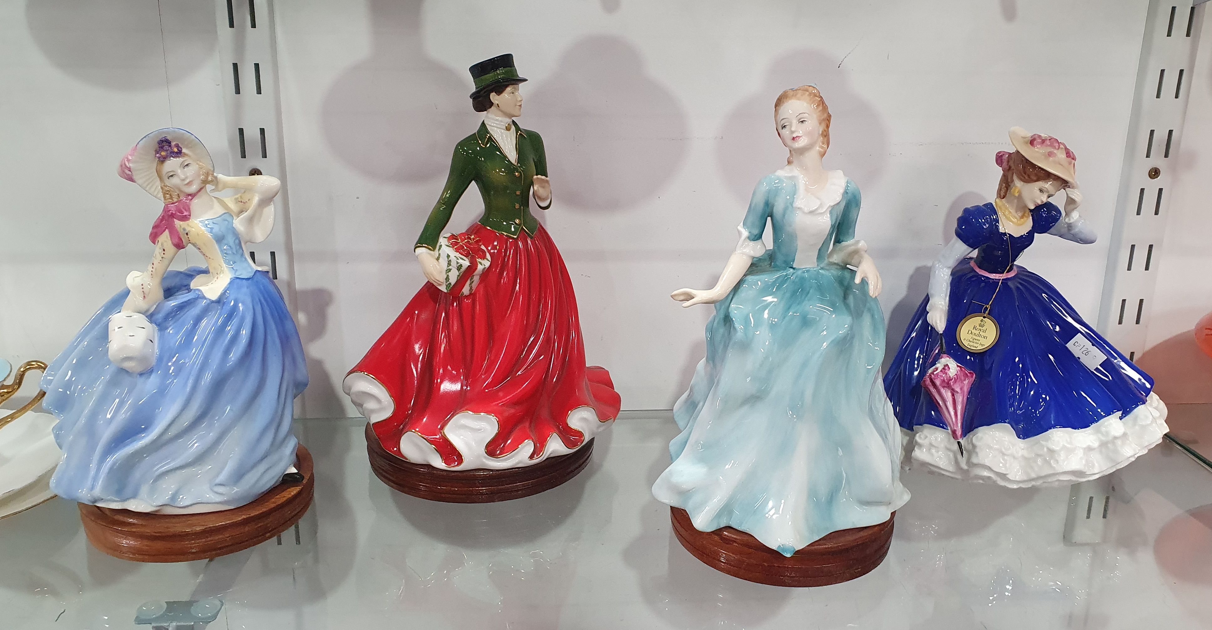 FOUR ROYAL DOULTON PORCELAIN LADY FIGURES