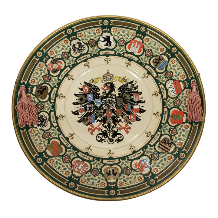A large Mettlach stoneware charger or wall plaque No. 2013