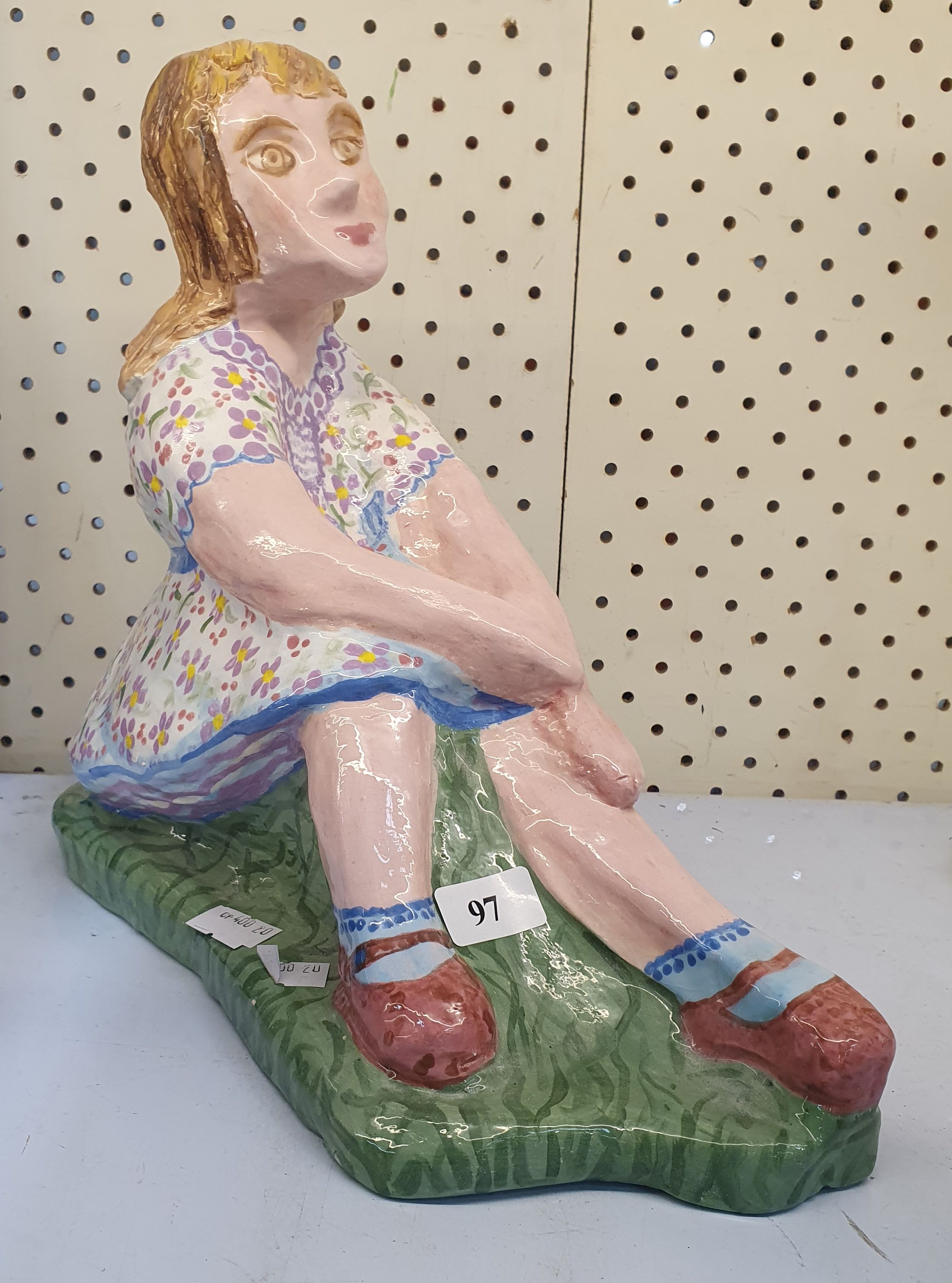 169 · A 'RELAXING GIRL' CERAMIC ORNAMENT