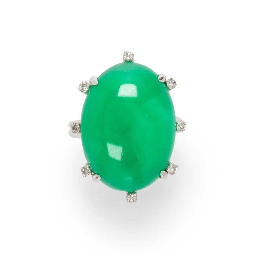 A jade, diamond and fourteen karat white gold ring