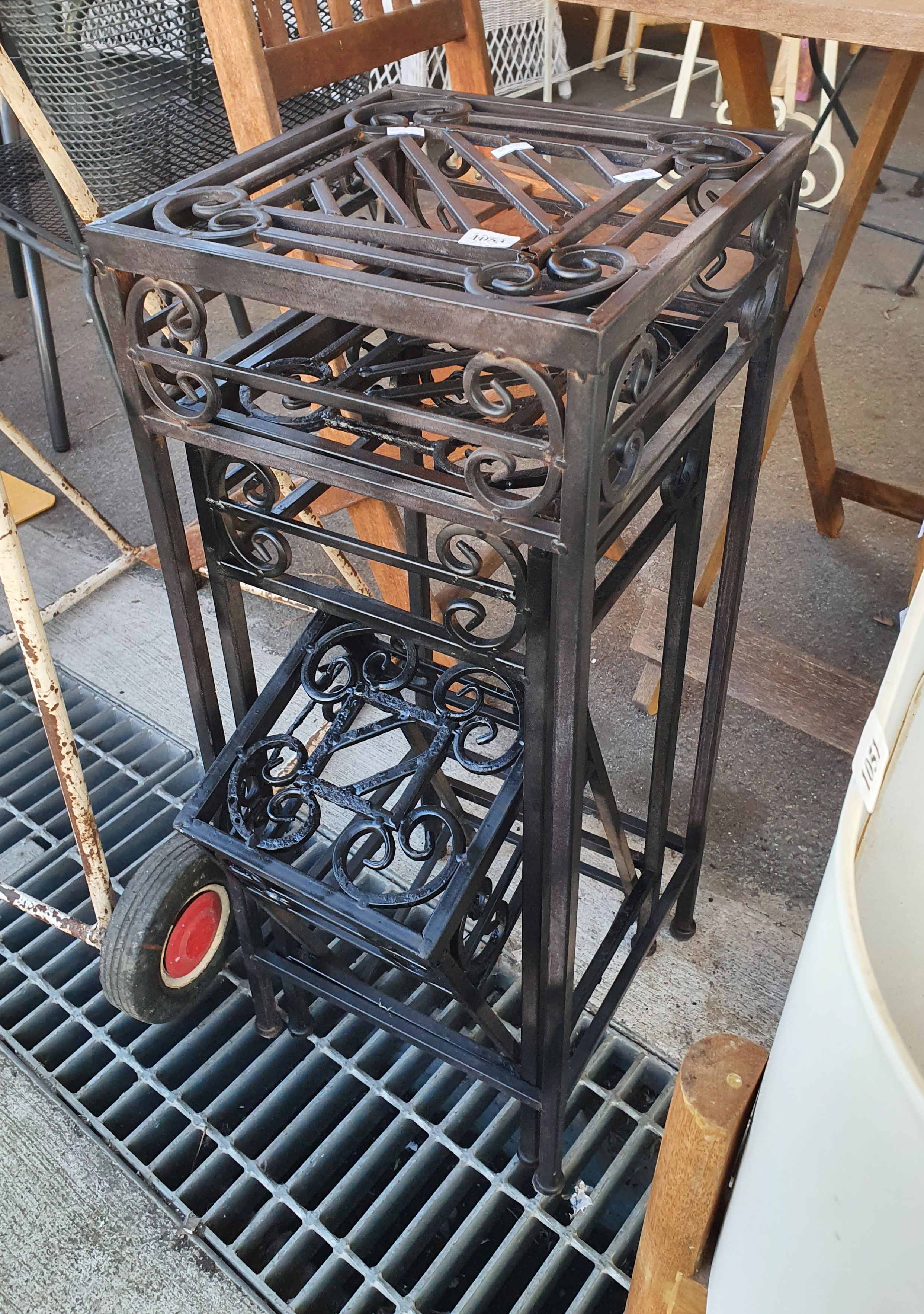 1053 · A NEST OF FOUR METAL SIDE TABLES