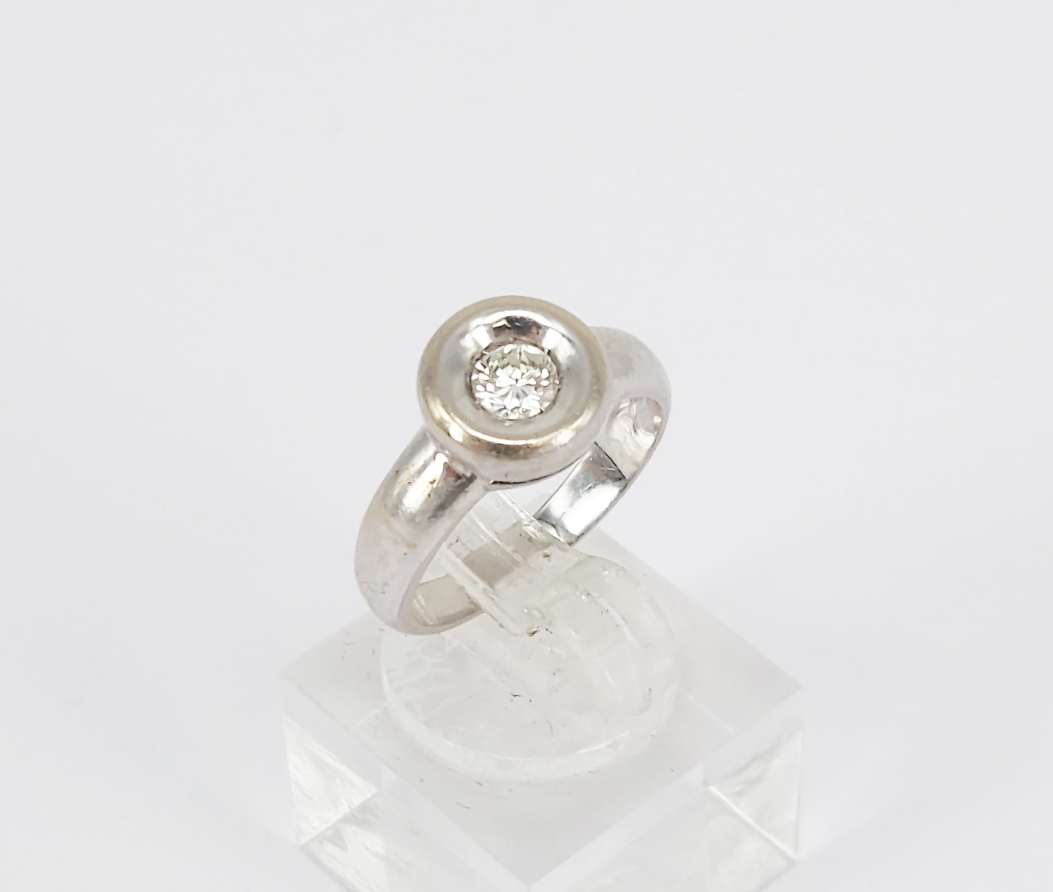 A 14k White Gold Diamond Solitaire Ring