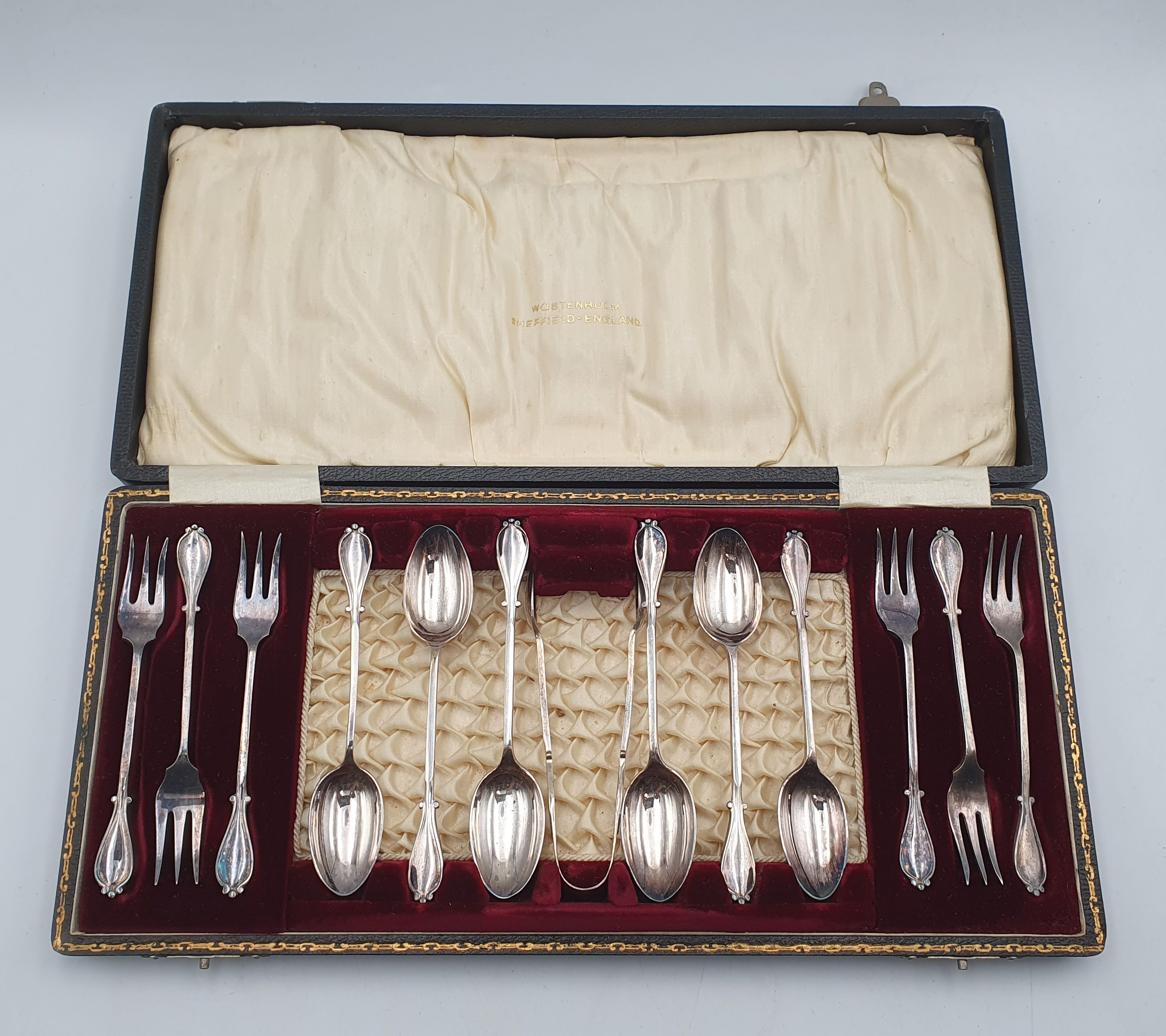 386 · A WOSTENHOLM (ENGLAND) SILVERPLATED FORK AND SPOON SET WITH TONGS