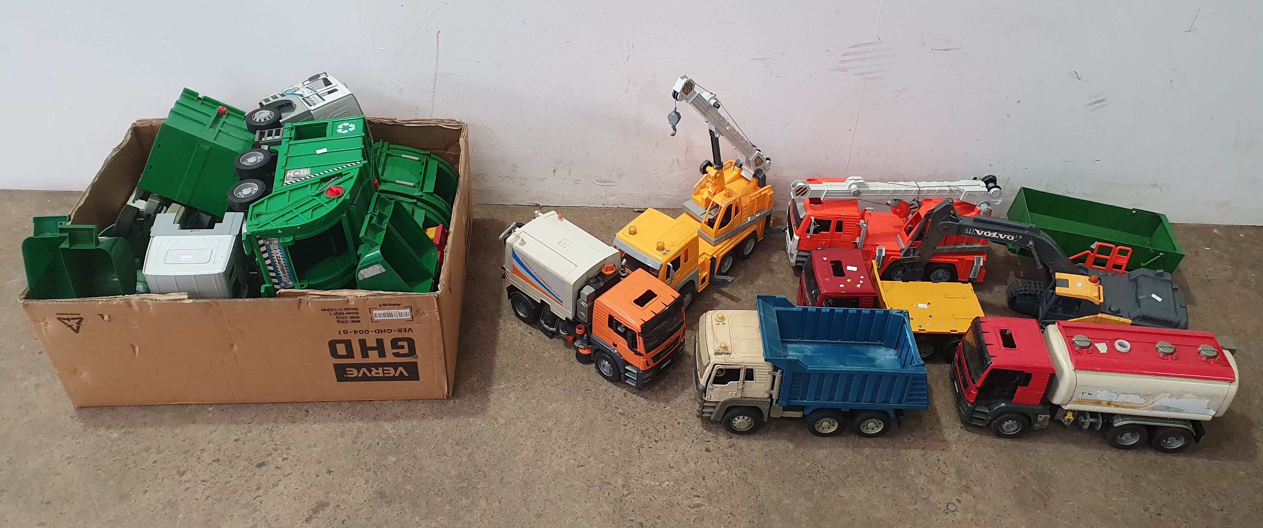 A LARGE GROUP OF TOY TRUCKS