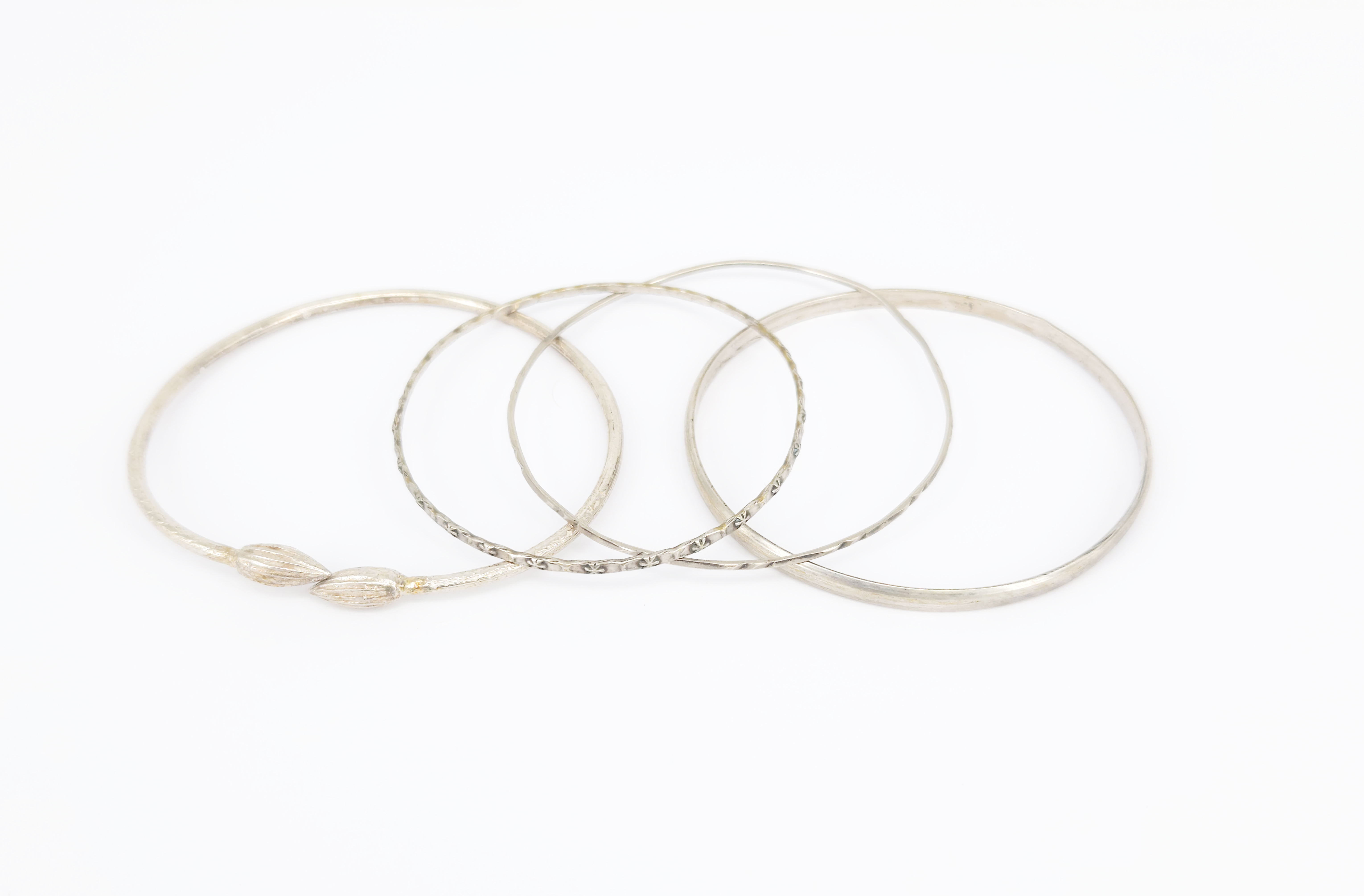 Four Silver Bangles