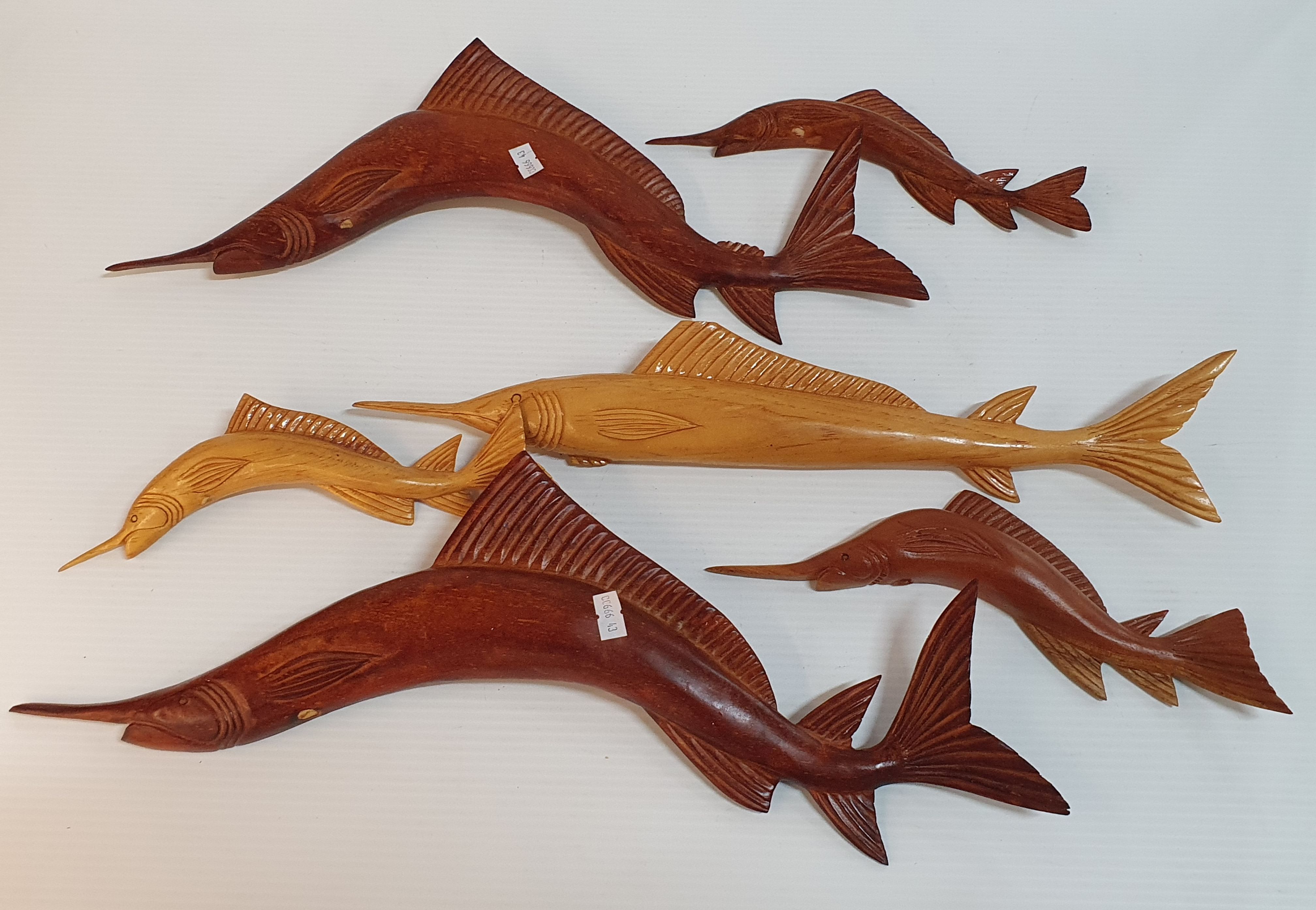 130 · A GROUP OF HANDCARVED TIMBER SWORDFISH