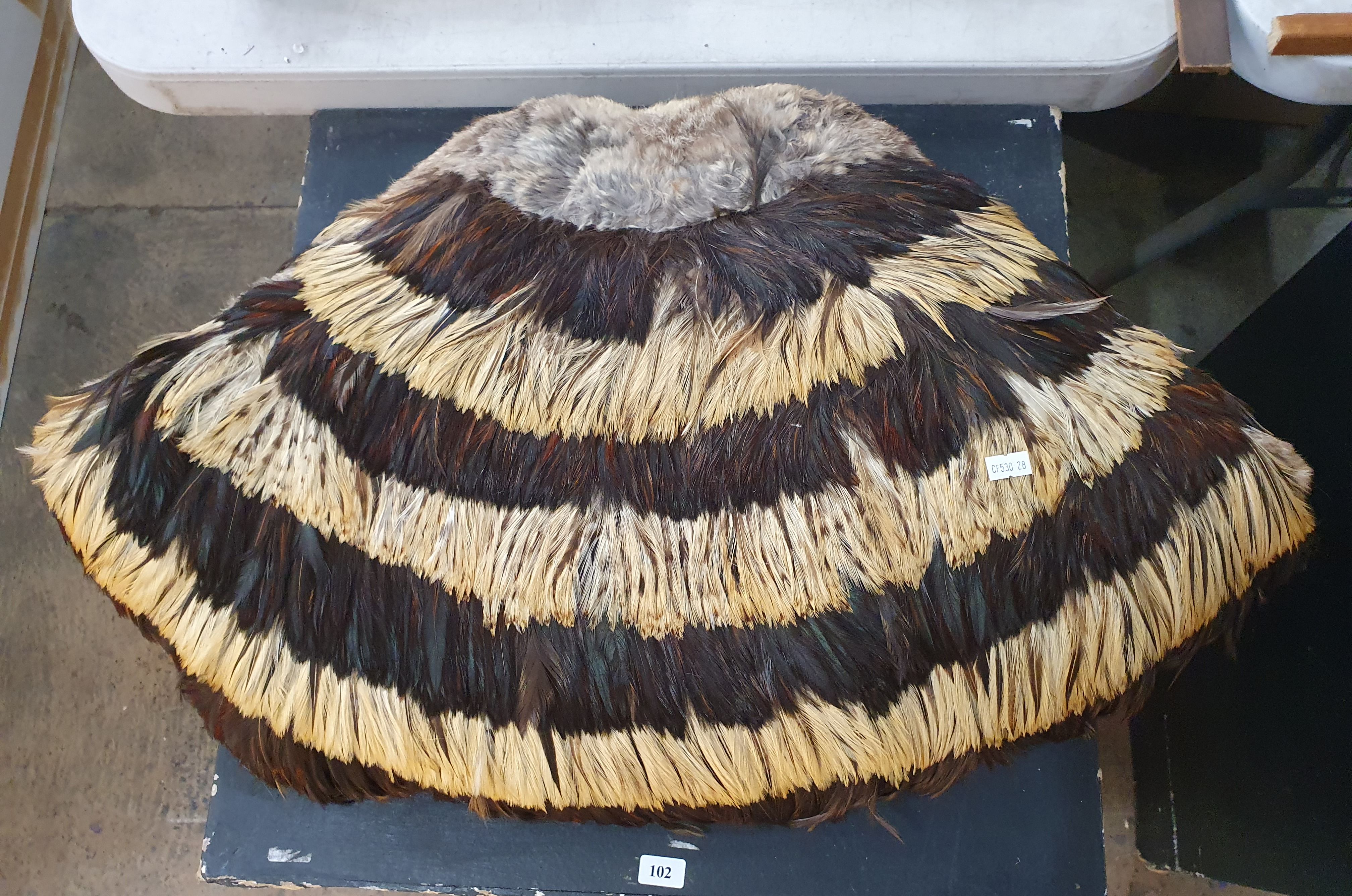 102 · A 'SWAN BRAND' (CHINA) FAN SHAPED CUSHION