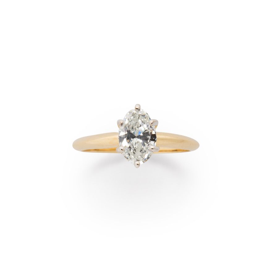 A diamond and fourteen karat gold ring