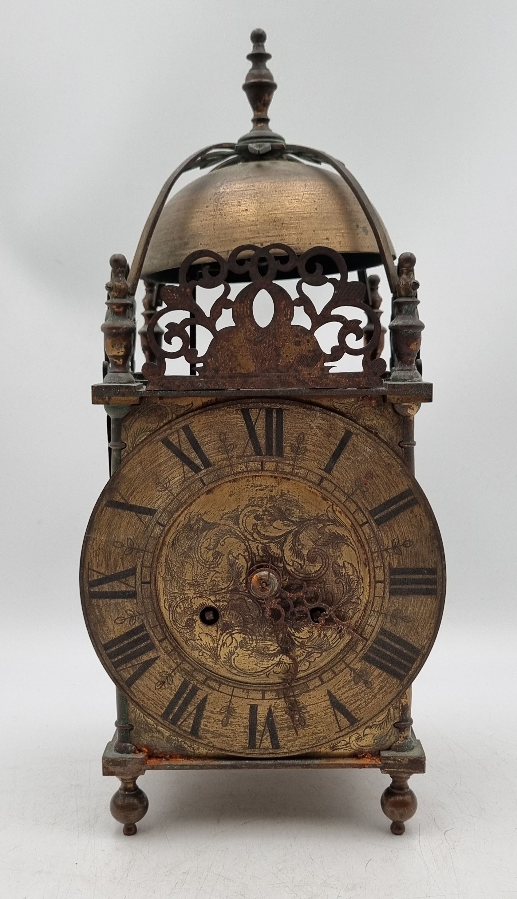 AN EARLY 20TH CENTURY BRASS LANTERN CLOCK