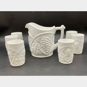 SEVEN PIECE MILK GLASS GRAPE PATTERNED DRINK SET.
