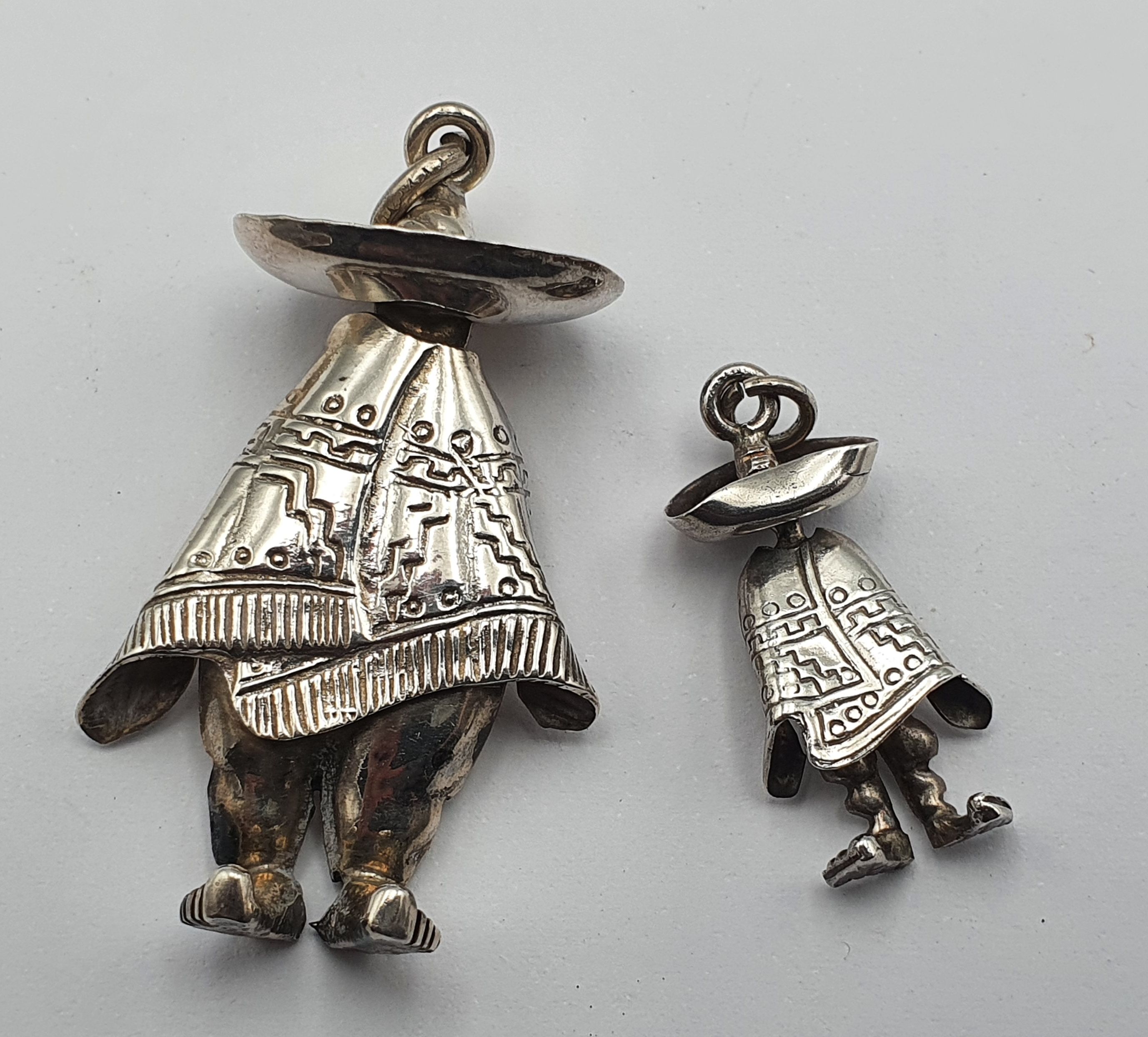 310 · TWO VINTAGE MEXICAN SILVER PENDANTS