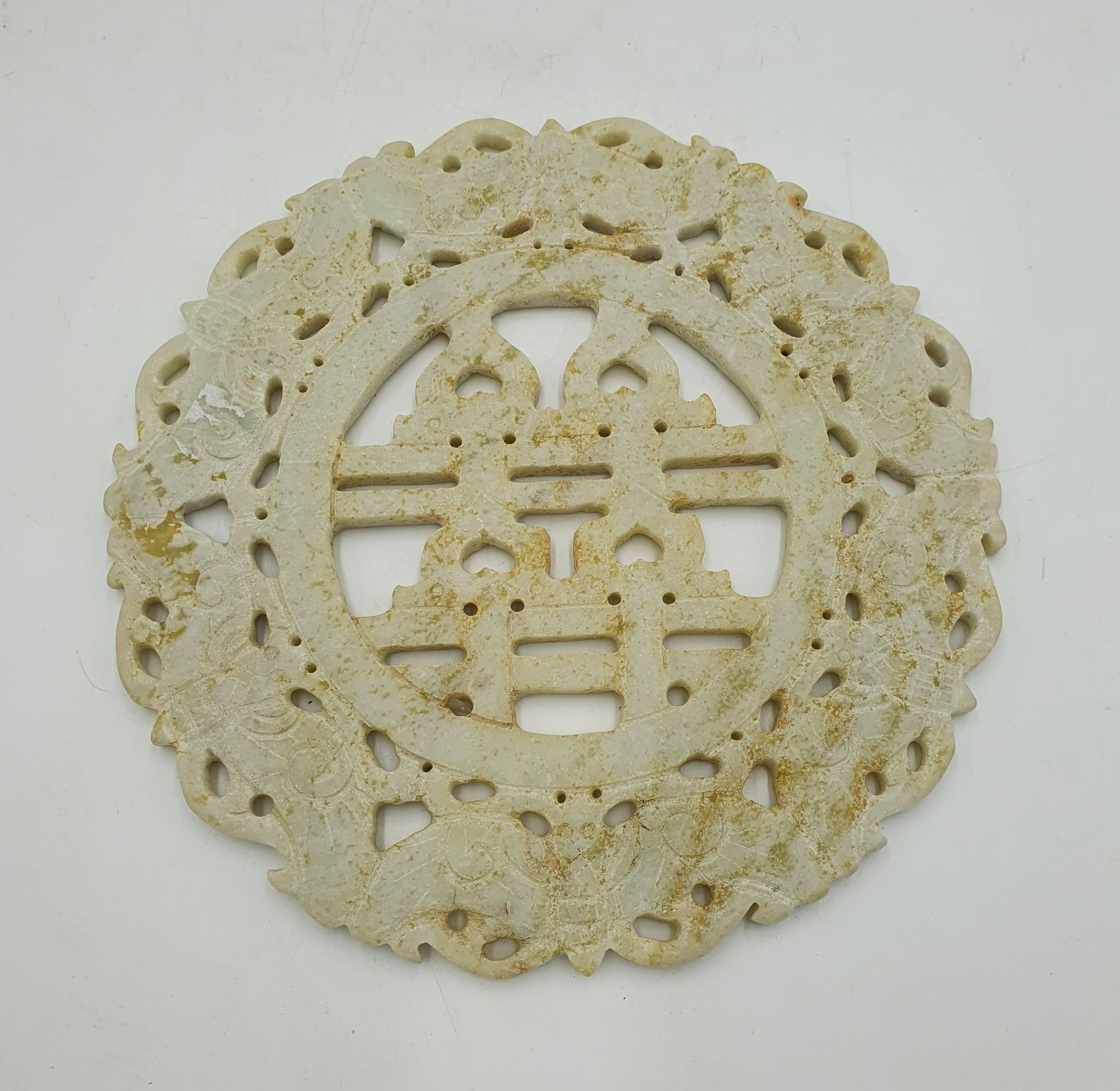 A Chinese Carved Hard Green Stone Bi Disk
