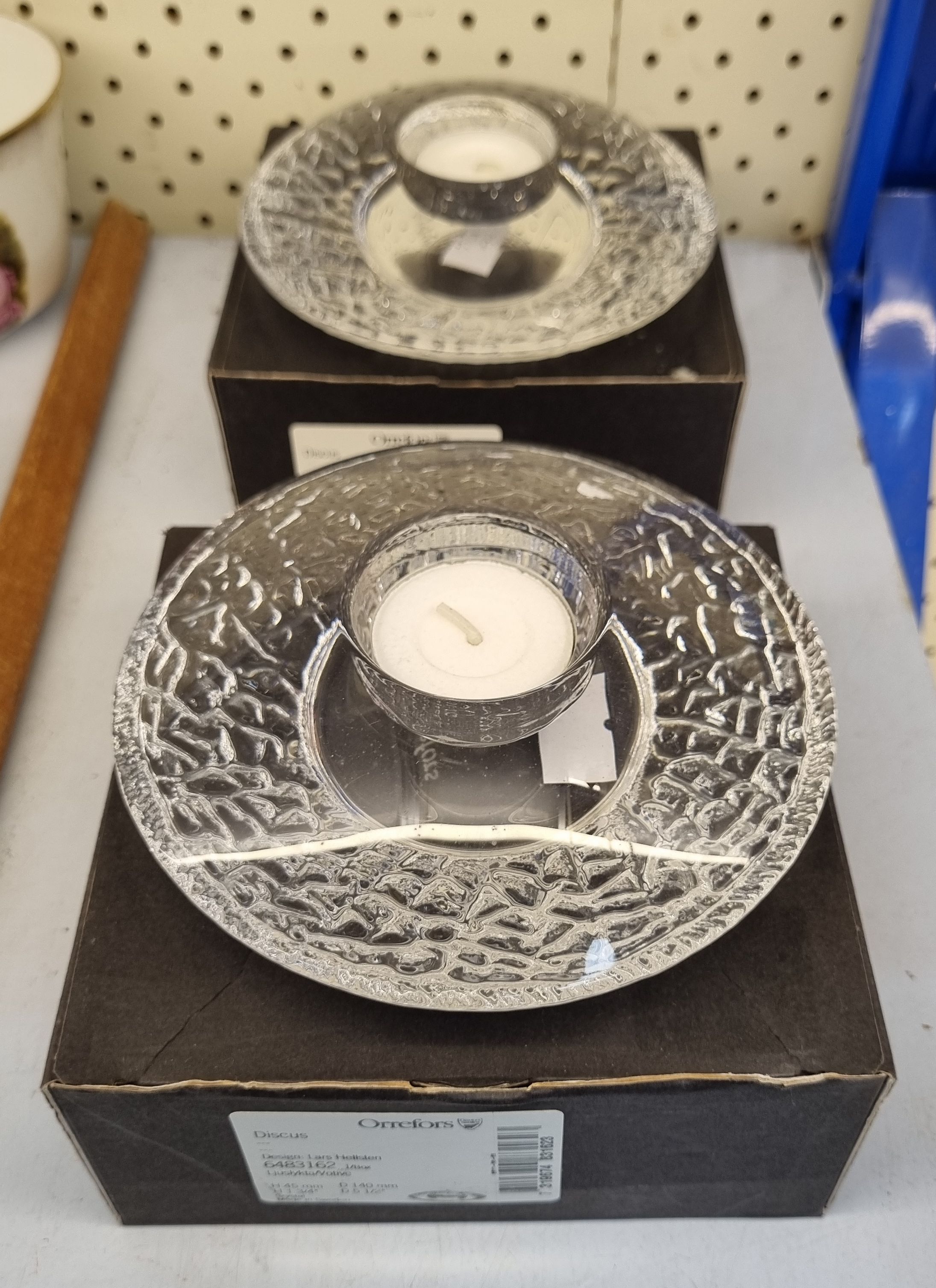 35 · A PAIR OF ORREFORS DISCUS GLASS TEALIGHT HOLDERS