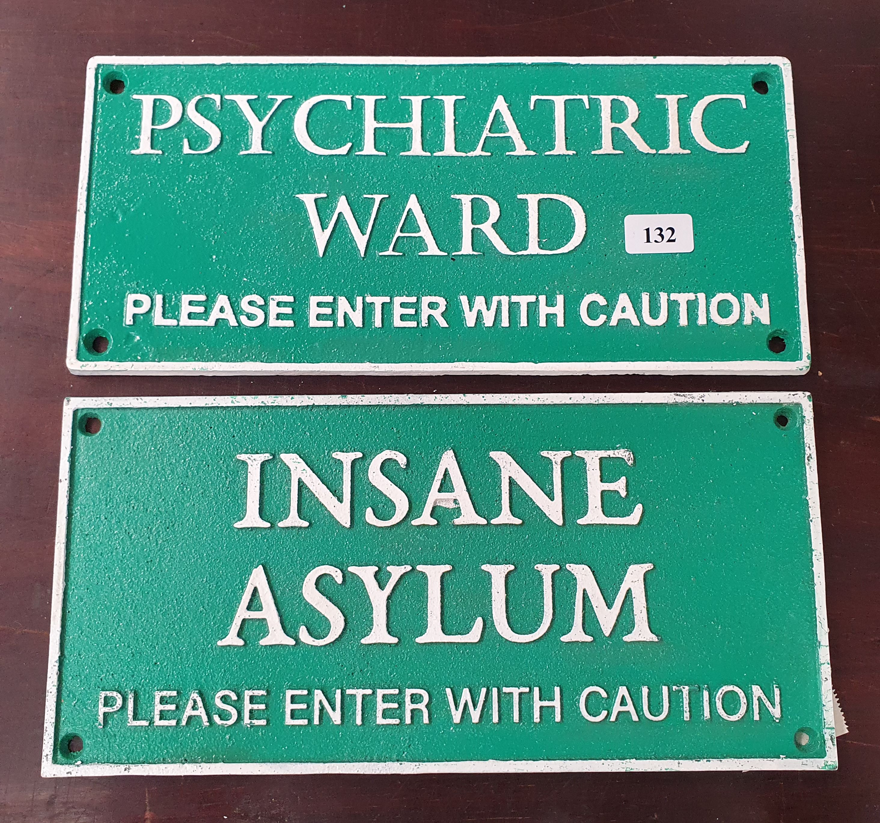 132 · TWO CAST IRON REPRODUCTION SIGNS