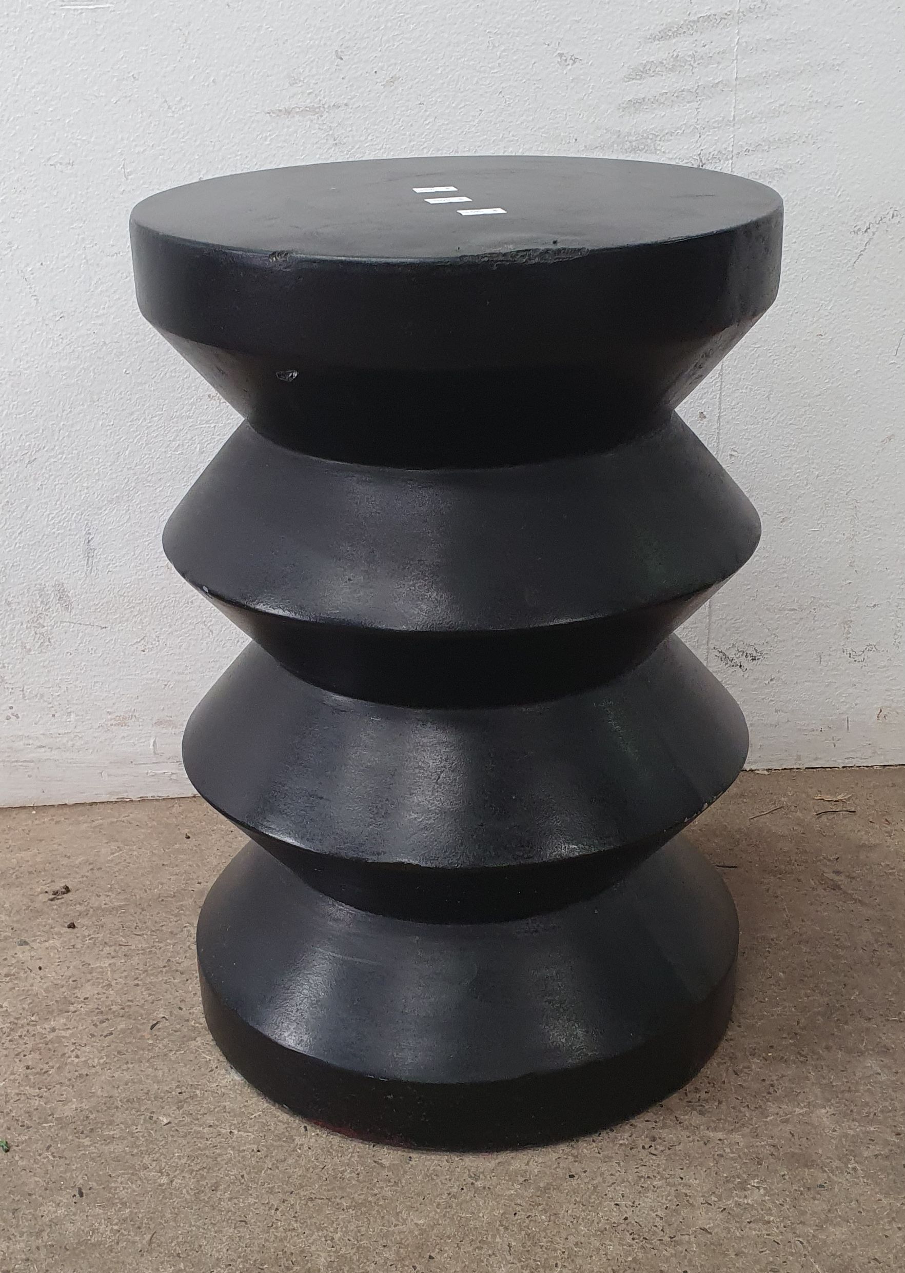 A Black Pedestal/ Stool
