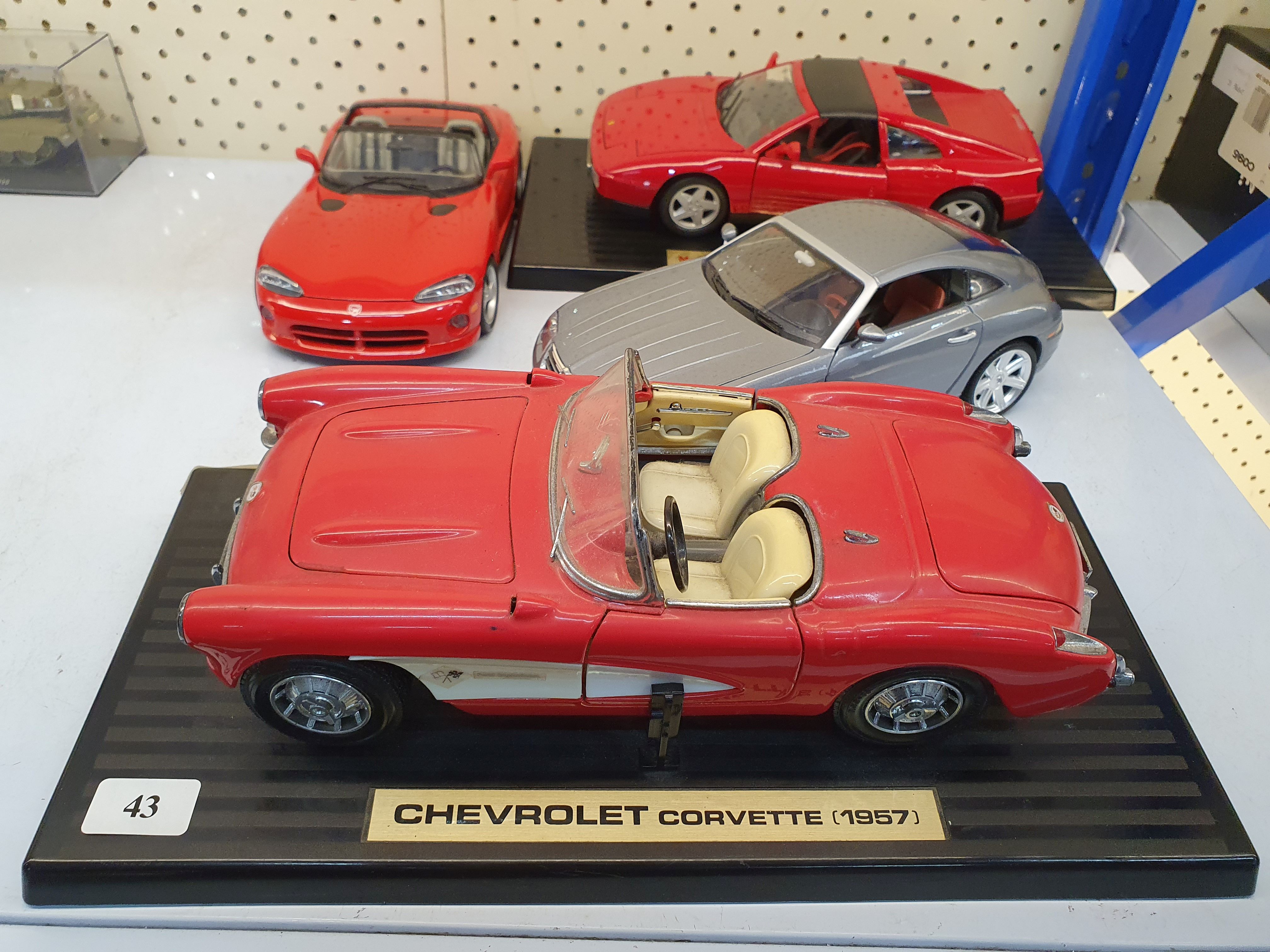 43 · FOUR DIE-CAST MODEL CARS