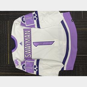 Hockey Fights Cancer warm up jerseys hang in the Colorado