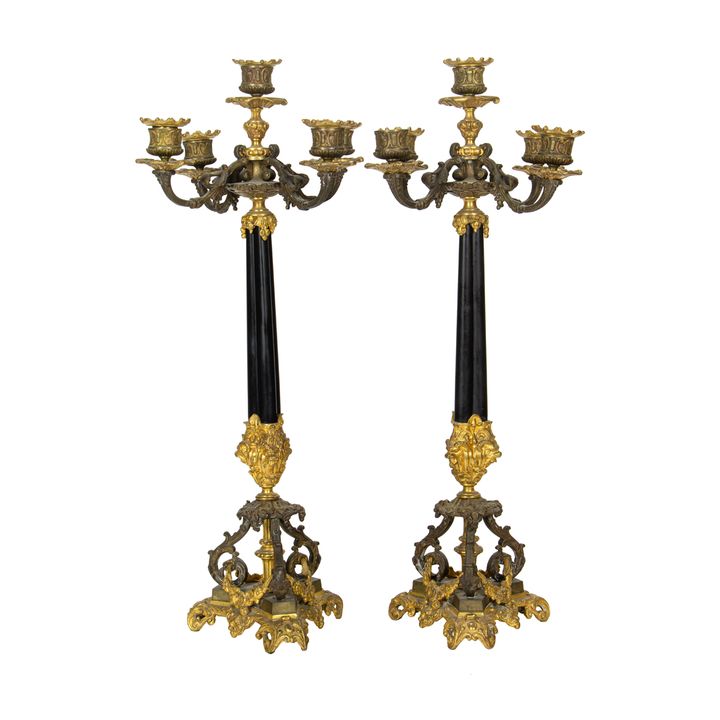 A pair of French Napoleon III patinated and gilt bronze five light candelabra, third quarter 19th century