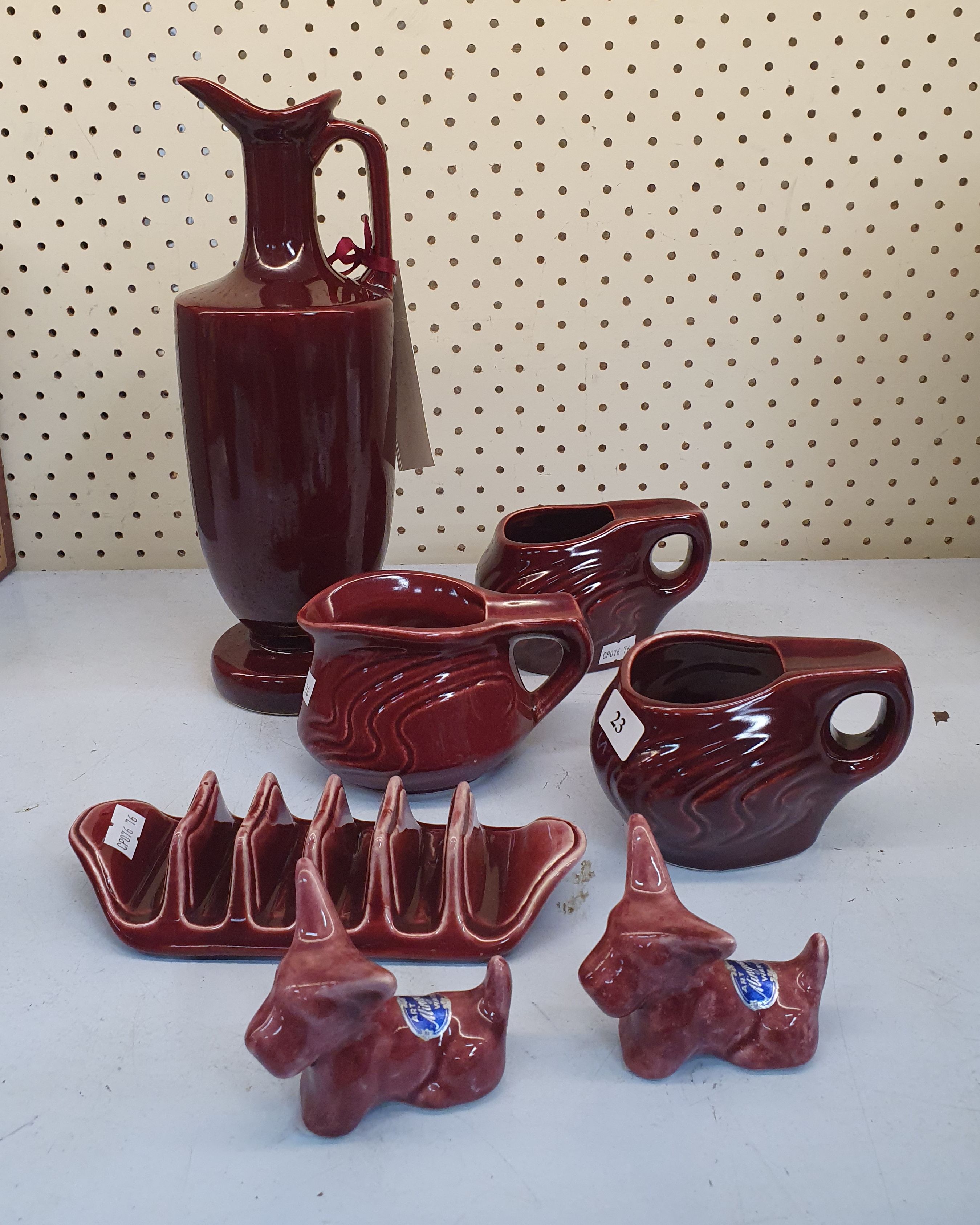 A Group Of Mcp Mingay Pieces In Burgundy