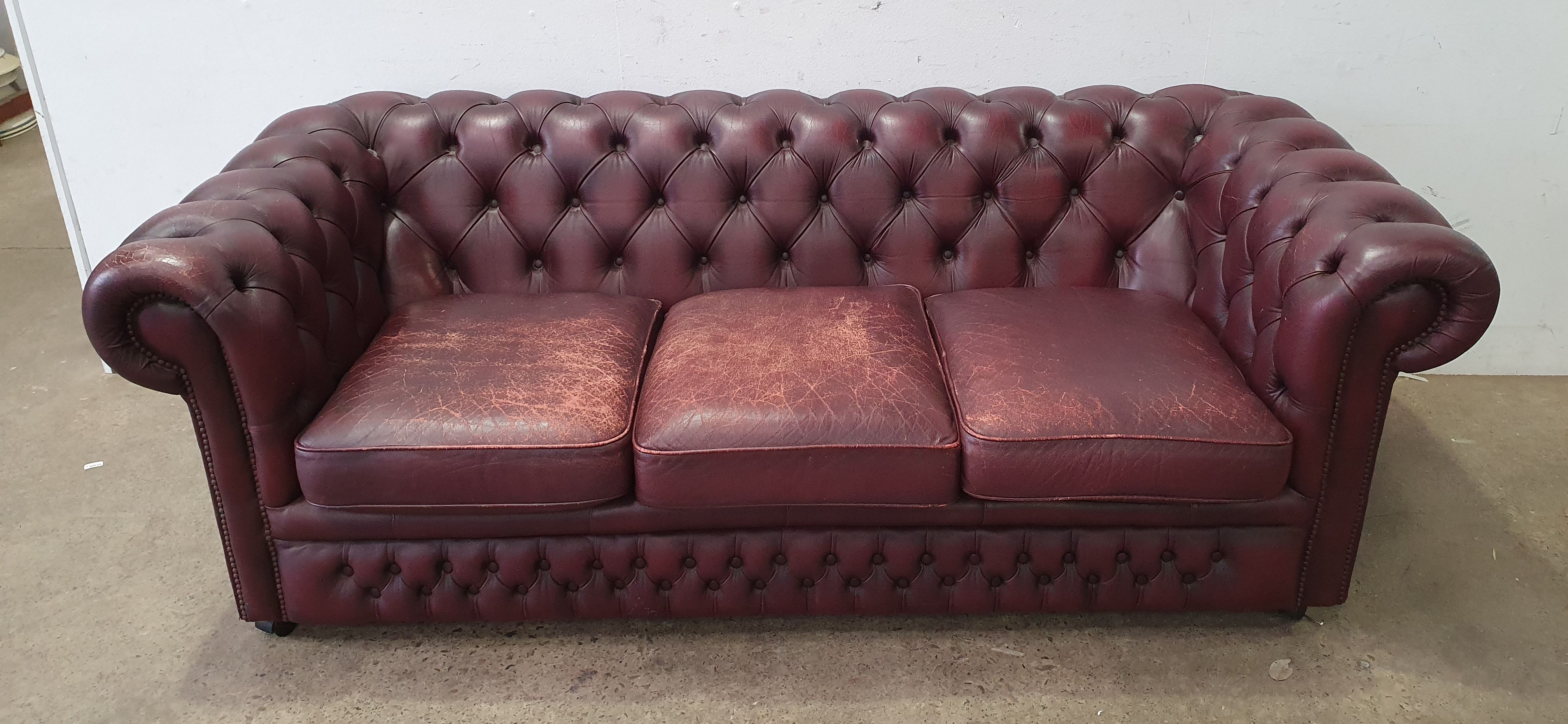 A Gascoigne Leather Button Back Three Seater Chesterfield Settee