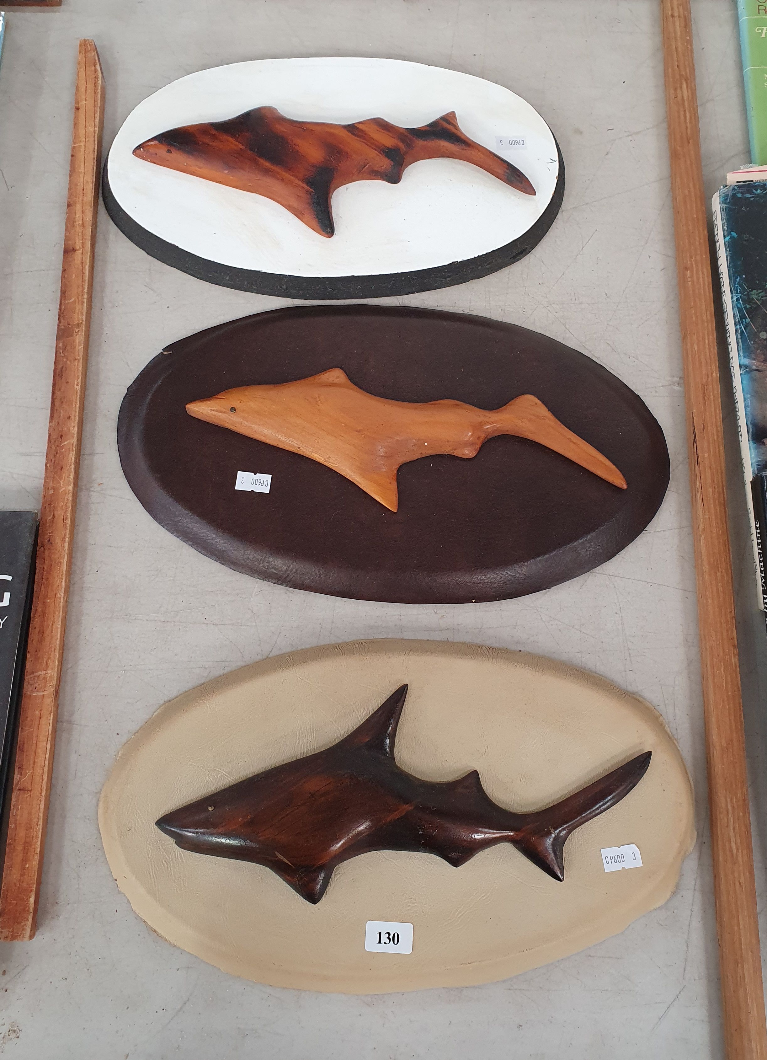 130 · THREE MOUNTED CARVED TIMBER SHARKS