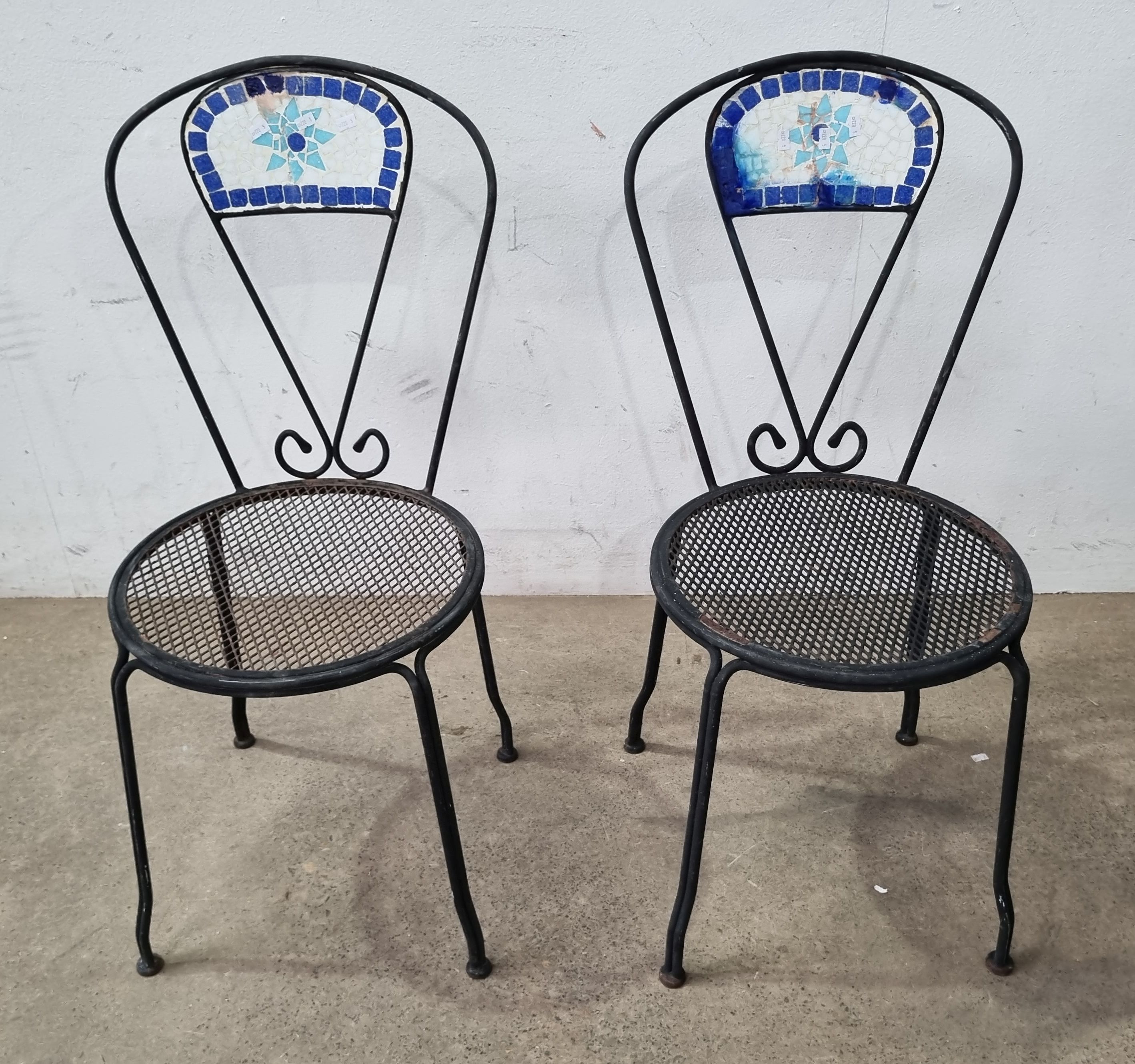 A Pair Of Metal Chairs
