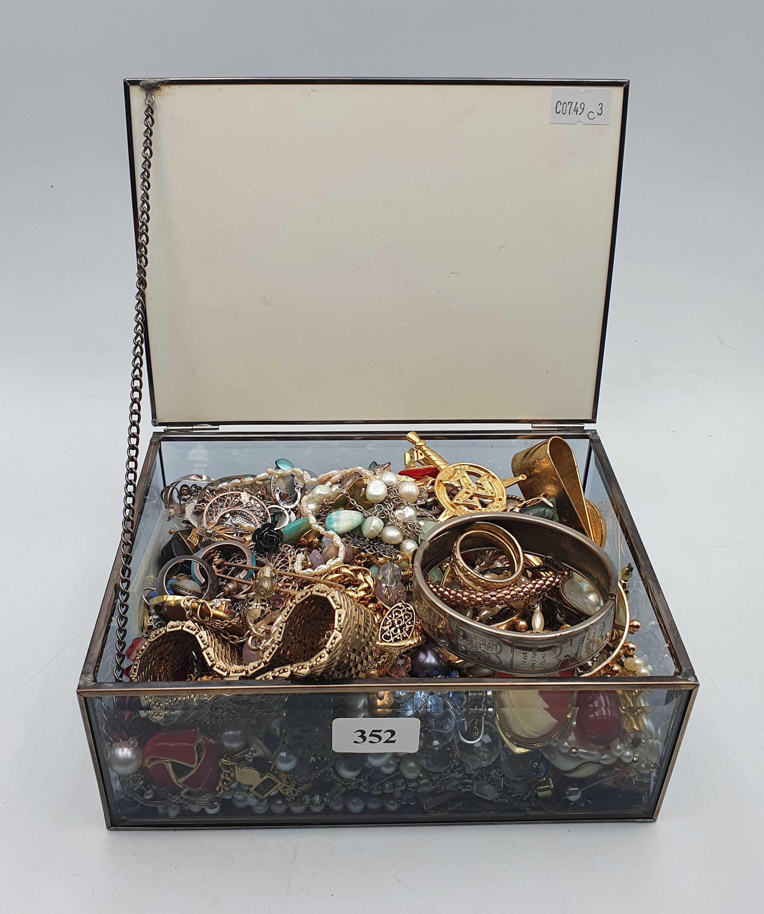 A BOX OF COSTUME JEWELLERY