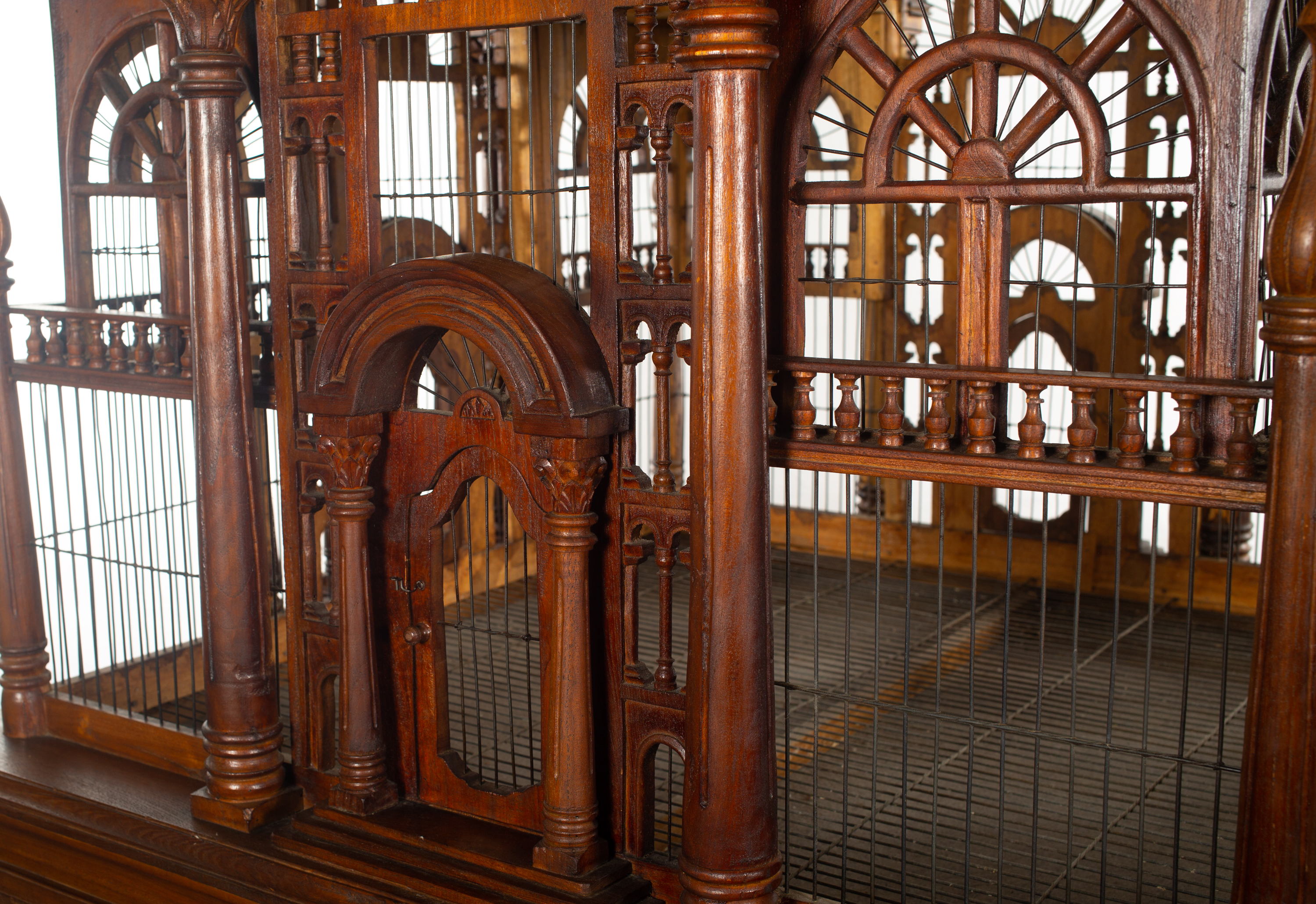 Lot - A VICTORIAN STYLE WIRE AND CARVED WOOD CATHEDRAL BIRDCAGE
