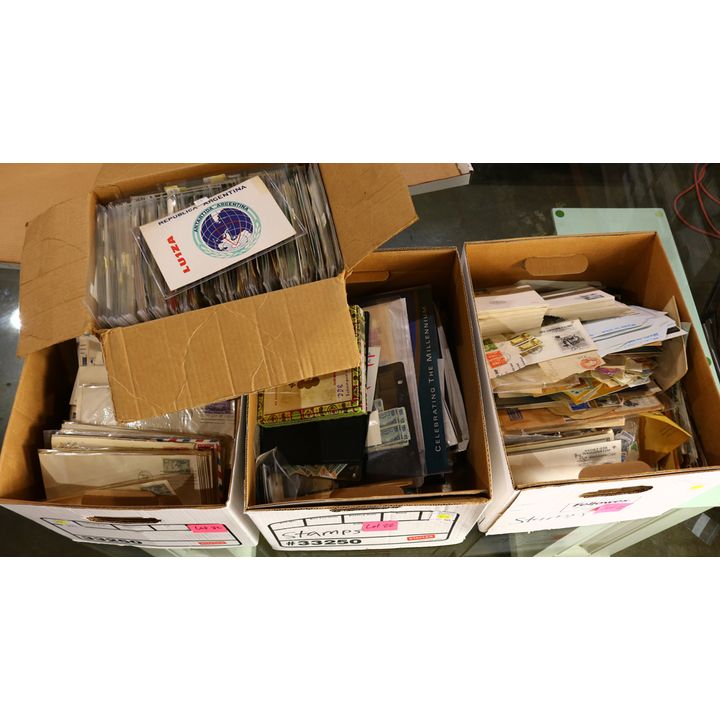 Four boxes of worldwide mixed material, including commerical and first day US covers, stamps, and QSL cards
