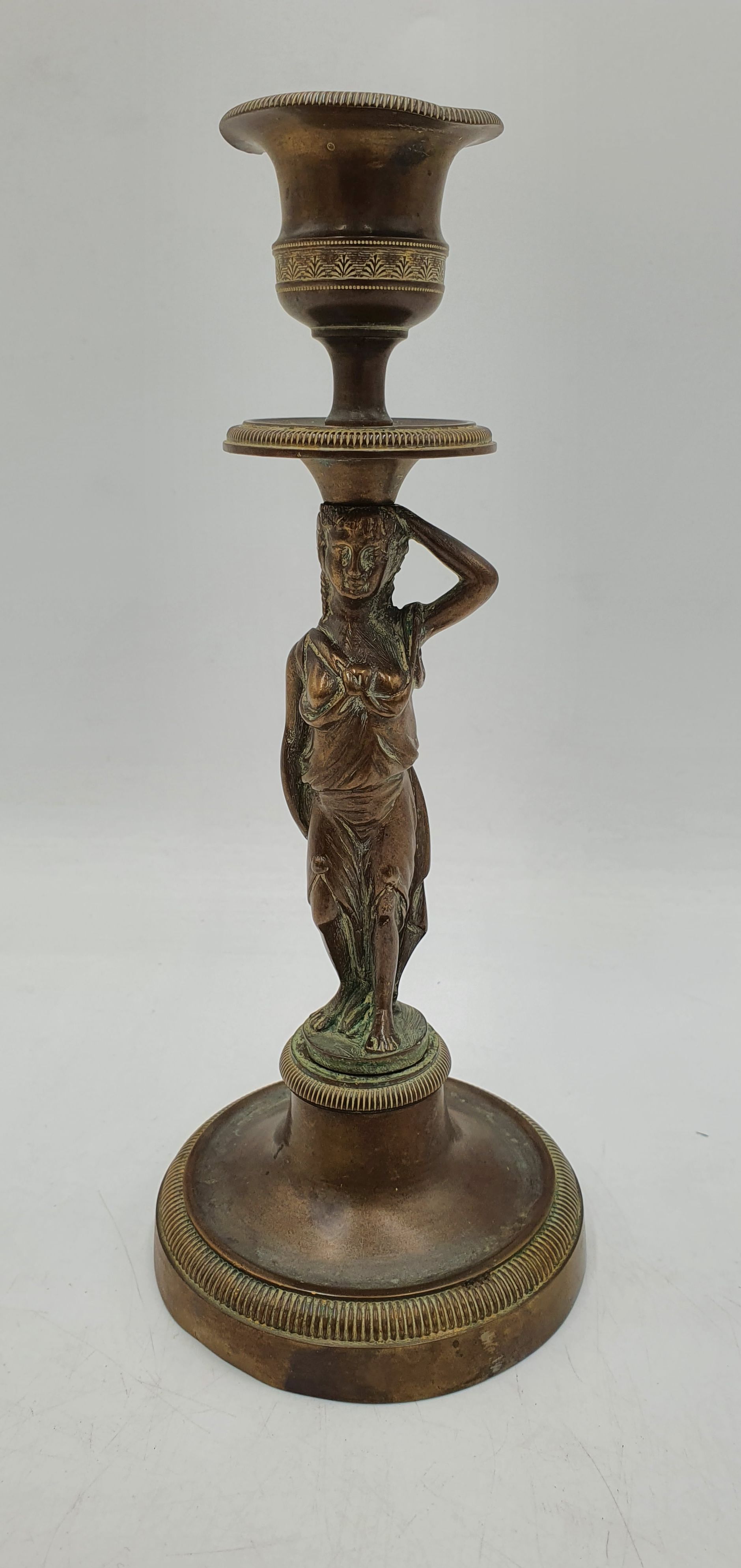 502 · A 19TH CENTURY BRASS FIGURAL CANDLESTICK