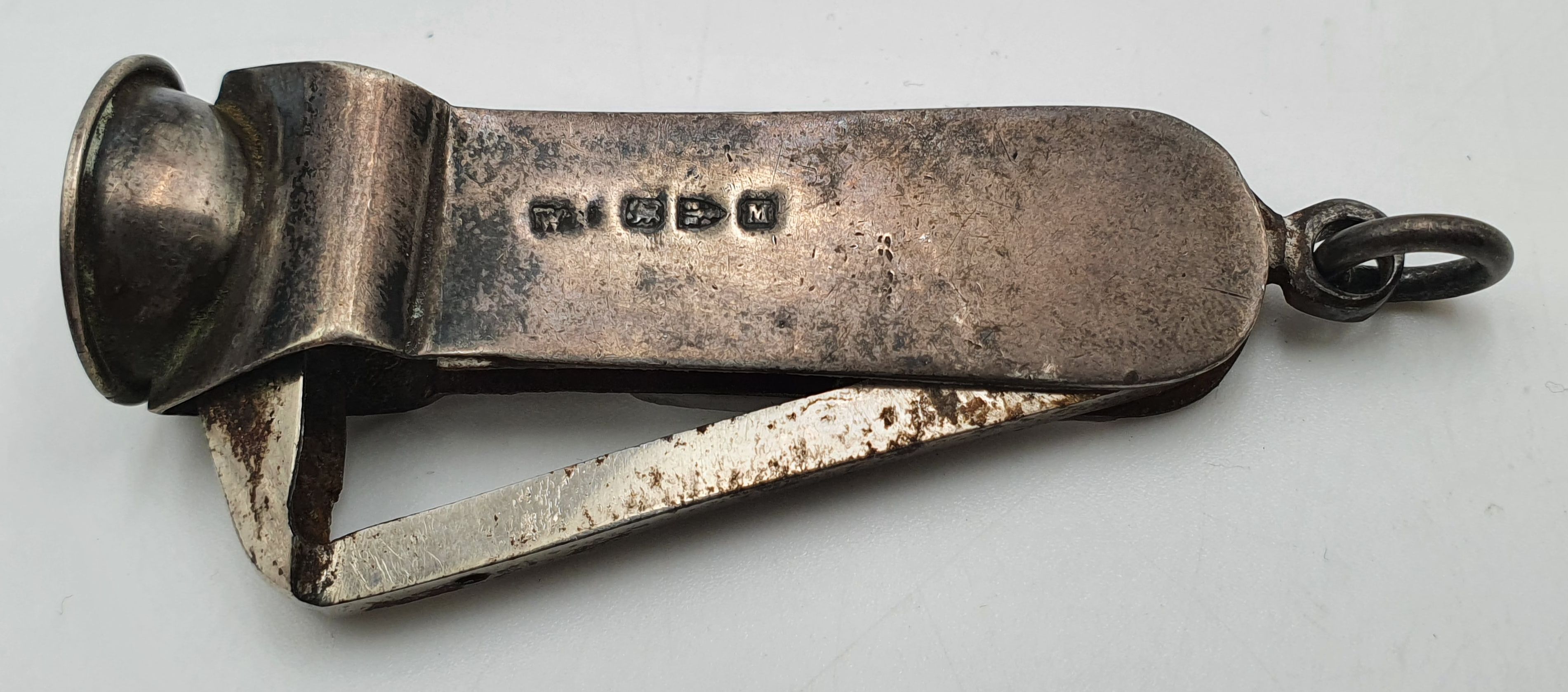 A SILVER CIGAR CUTTER