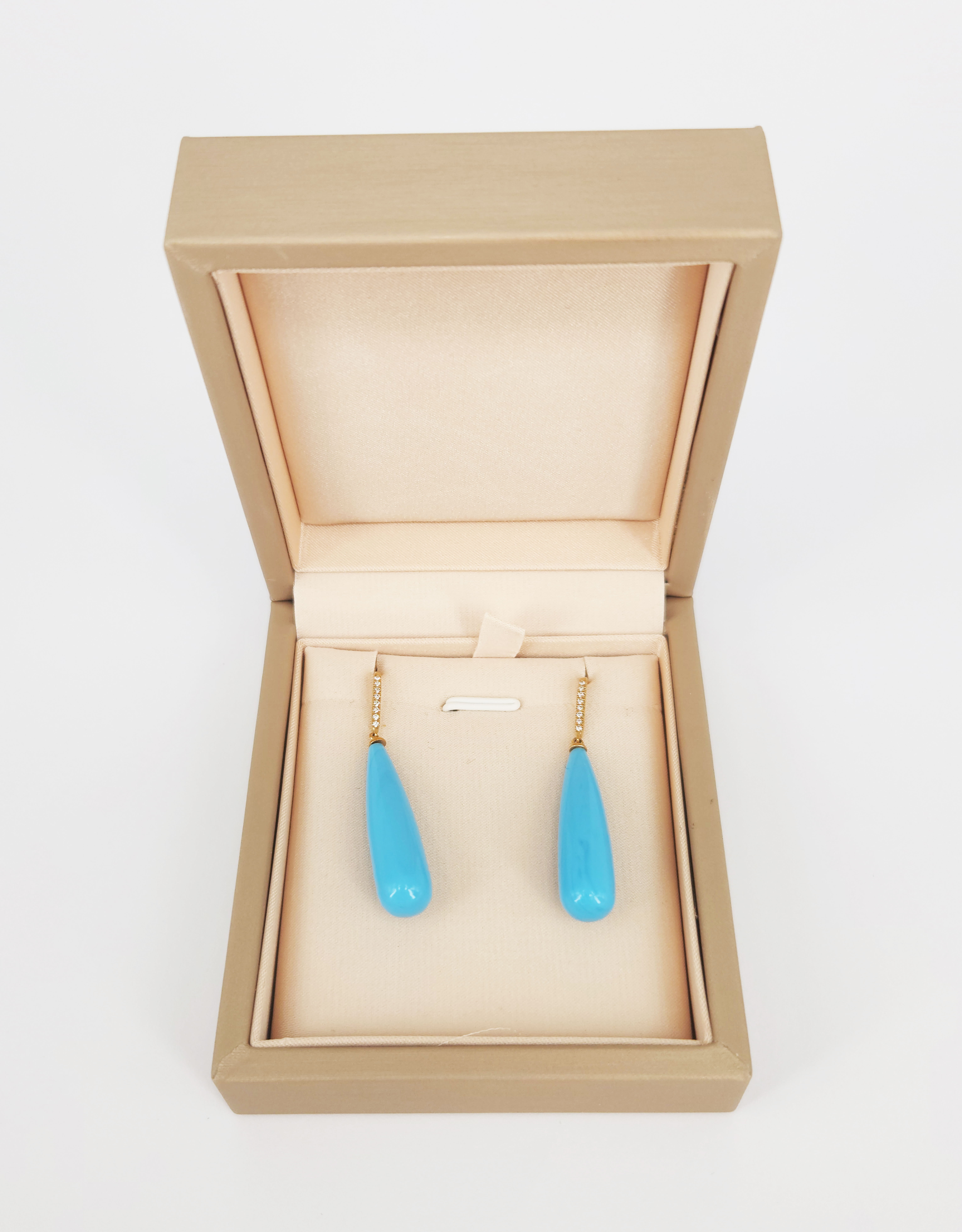 A Pair Of Gold Diamond And Blue Stone Drop Earrings