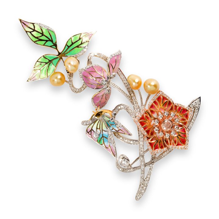 An enamel, diamond, pearl and eighteen karat white gold brooch