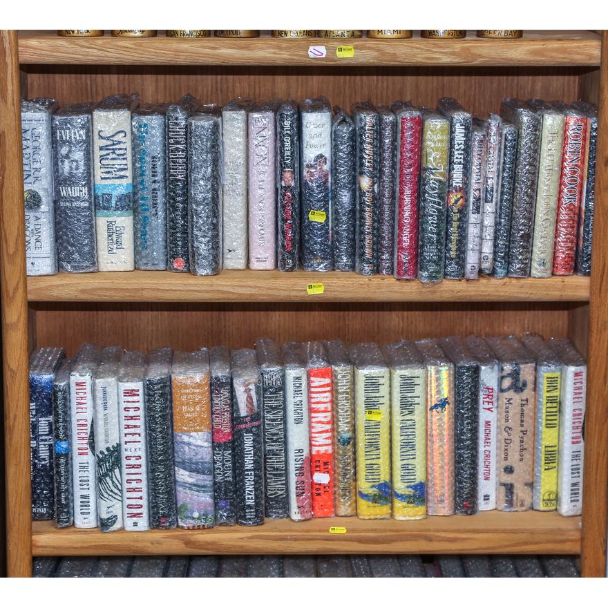 Two Shelves of Various Hardcover Books