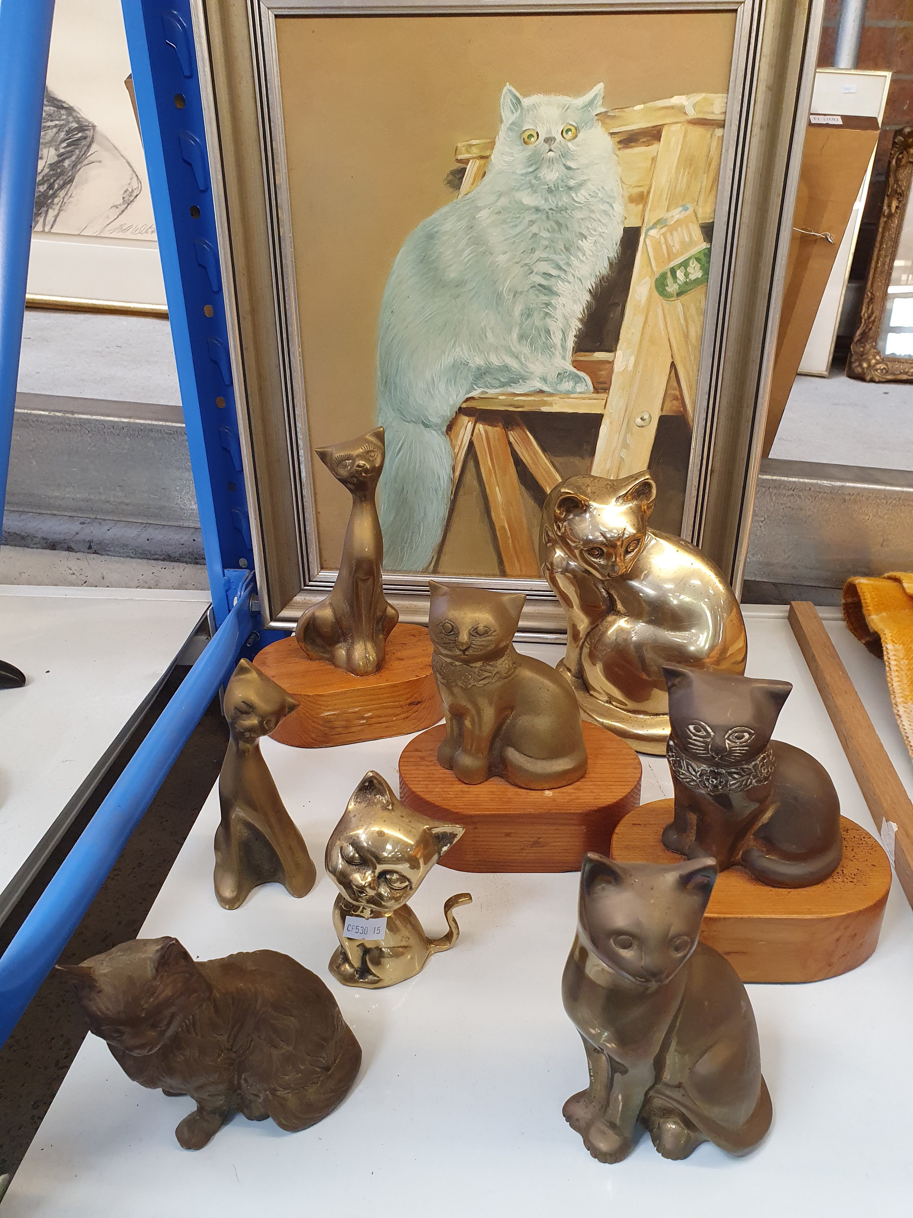 277 · A COLLECTION OF BRASS CATS AND A PORTRAIT PAINTING OF FLUFFY
